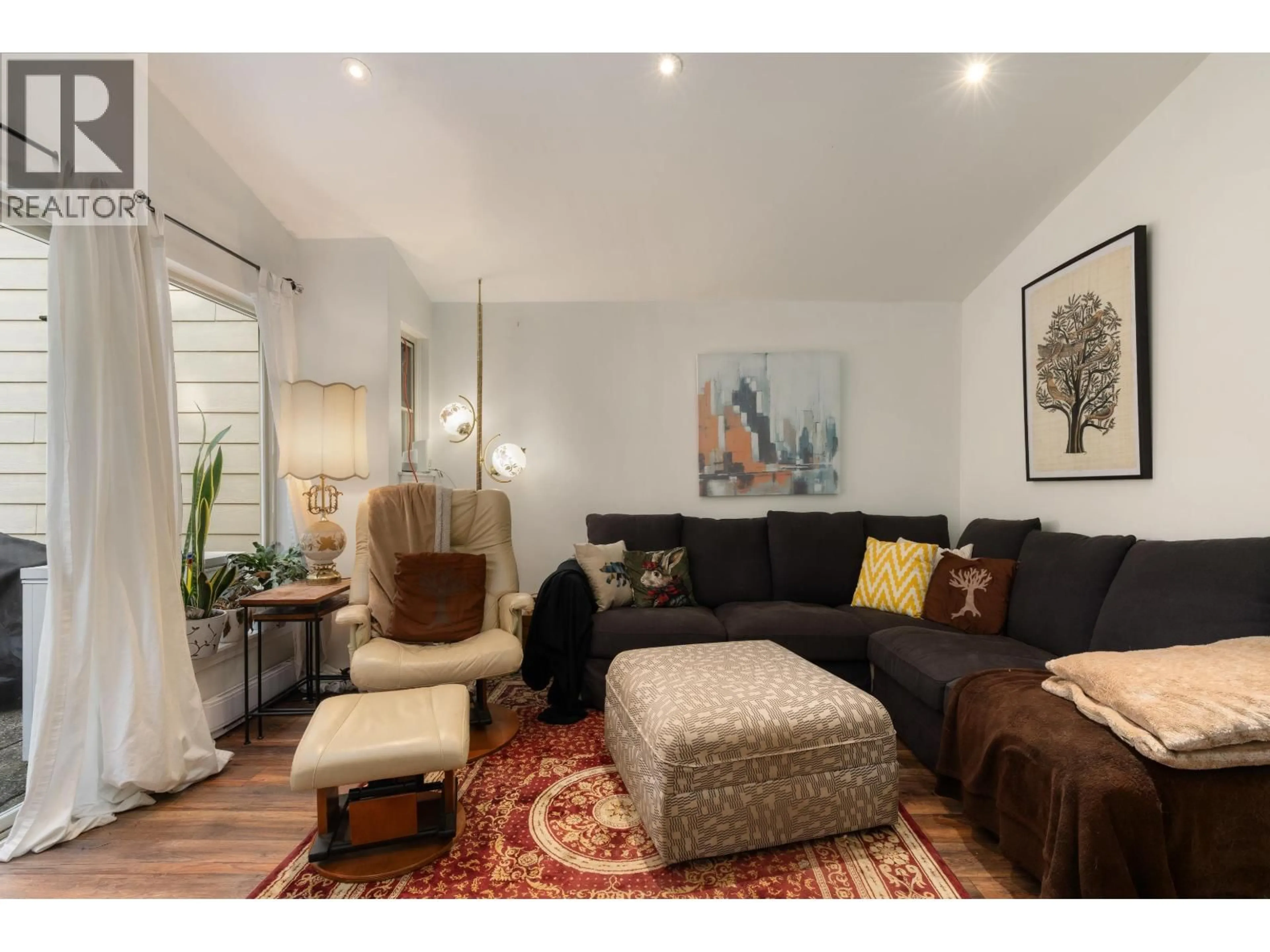 Living room with furniture, wood/laminate floor for 7355 CELISTA DRIVE, Vancouver British Columbia V5S4A1