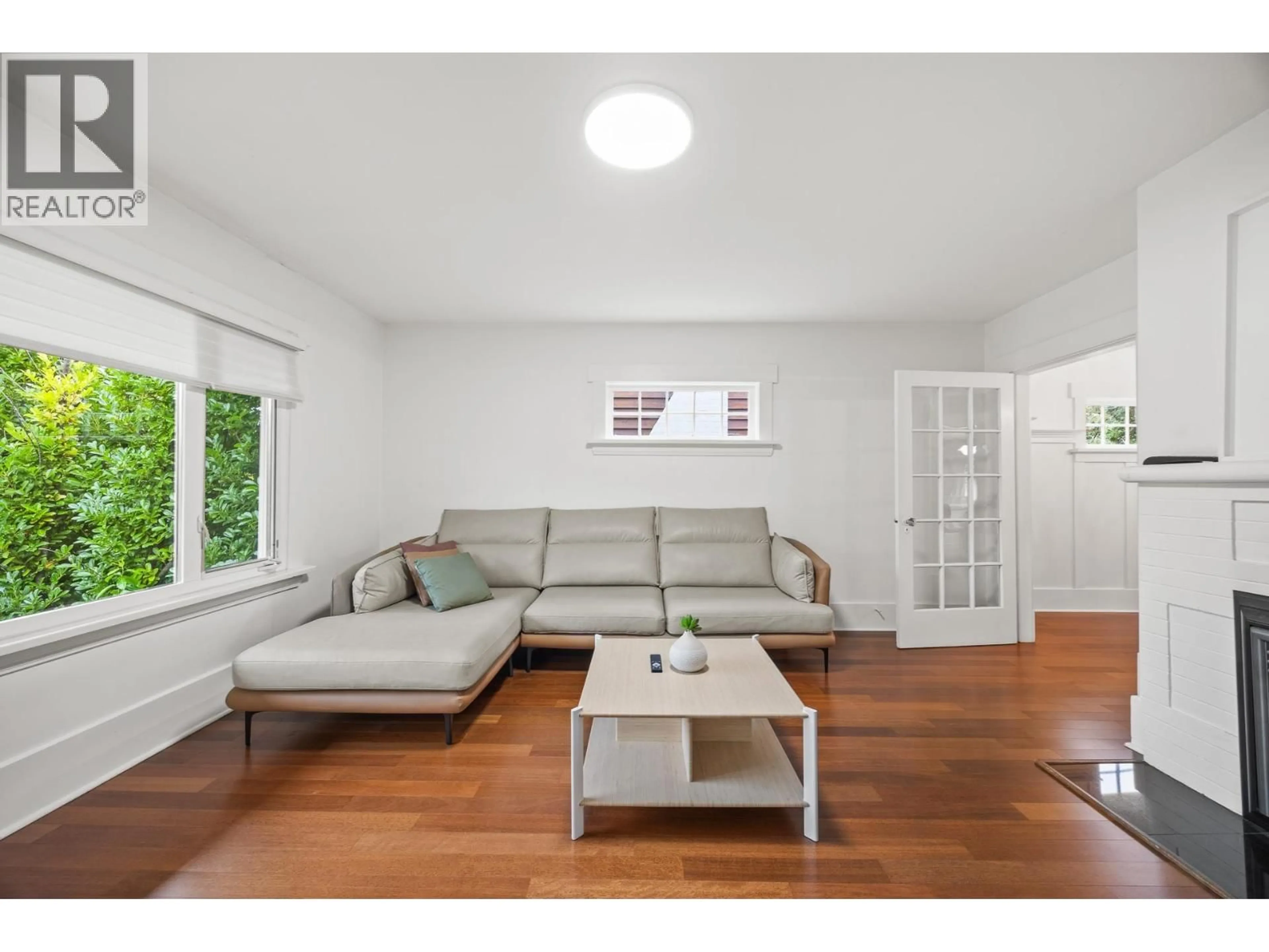 Living room with furniture, wood/laminate floor for 3276 W 21ST AVENUE, Vancouver British Columbia V6L1L2
