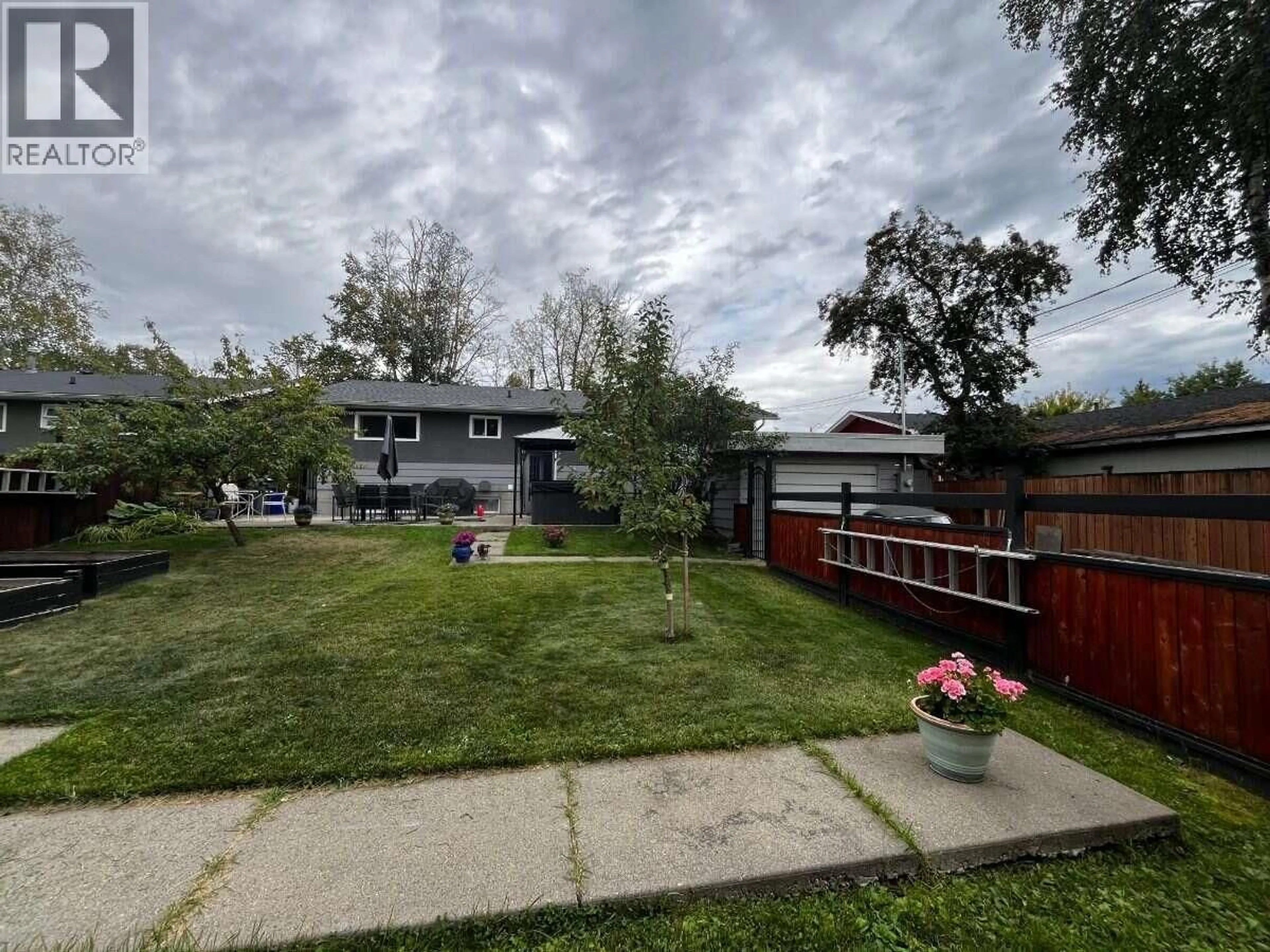 A pic from outside/outdoor area/front of a property/back of a property/a pic from drone, street for 321 OGILVIE STREET, Prince George British Columbia V2M3H7