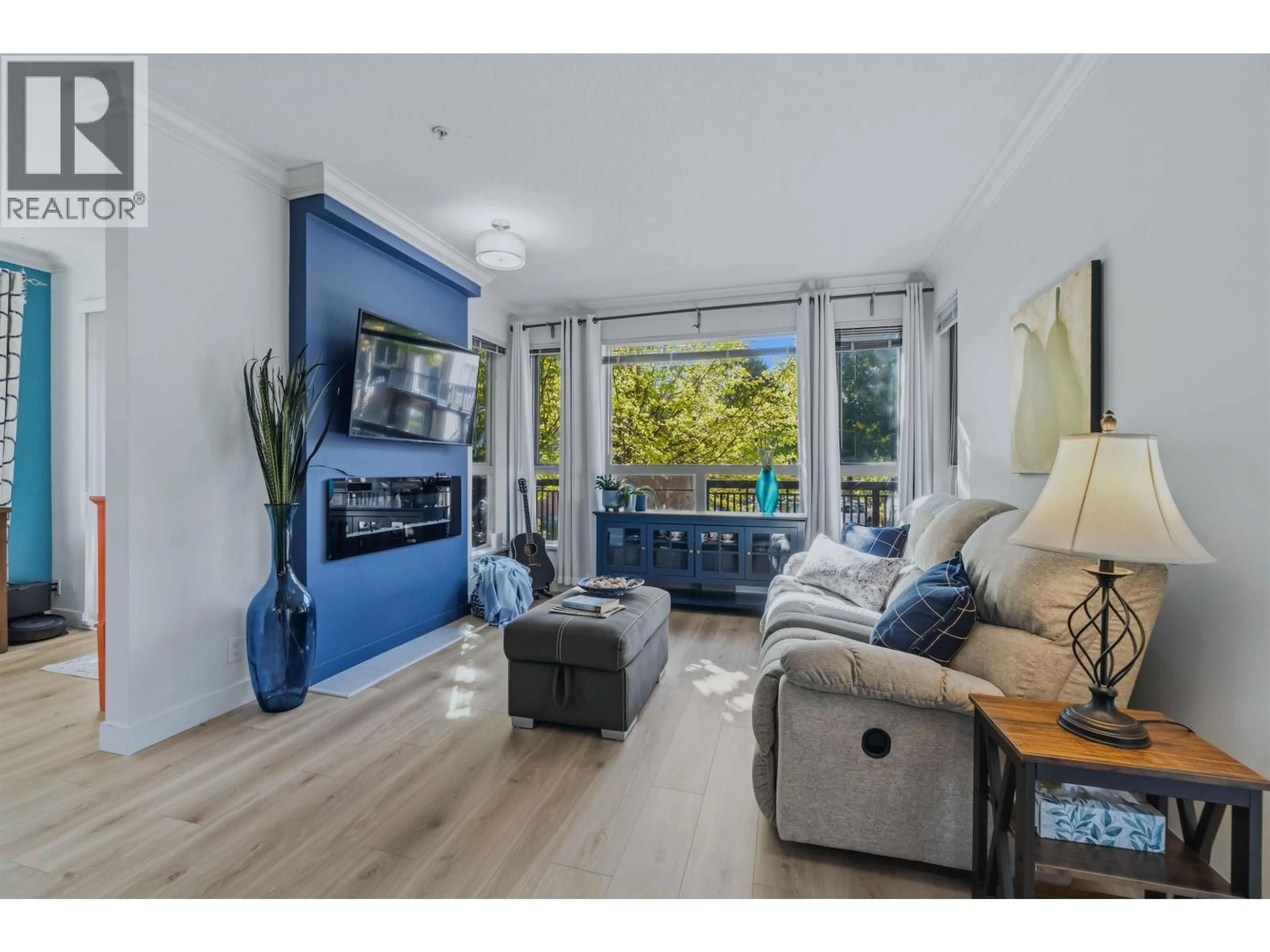 Living room with furniture, wood/laminate floor for 105 - 1153 KENSAL PLACE, Coquitlam British Columbia V3B0G8