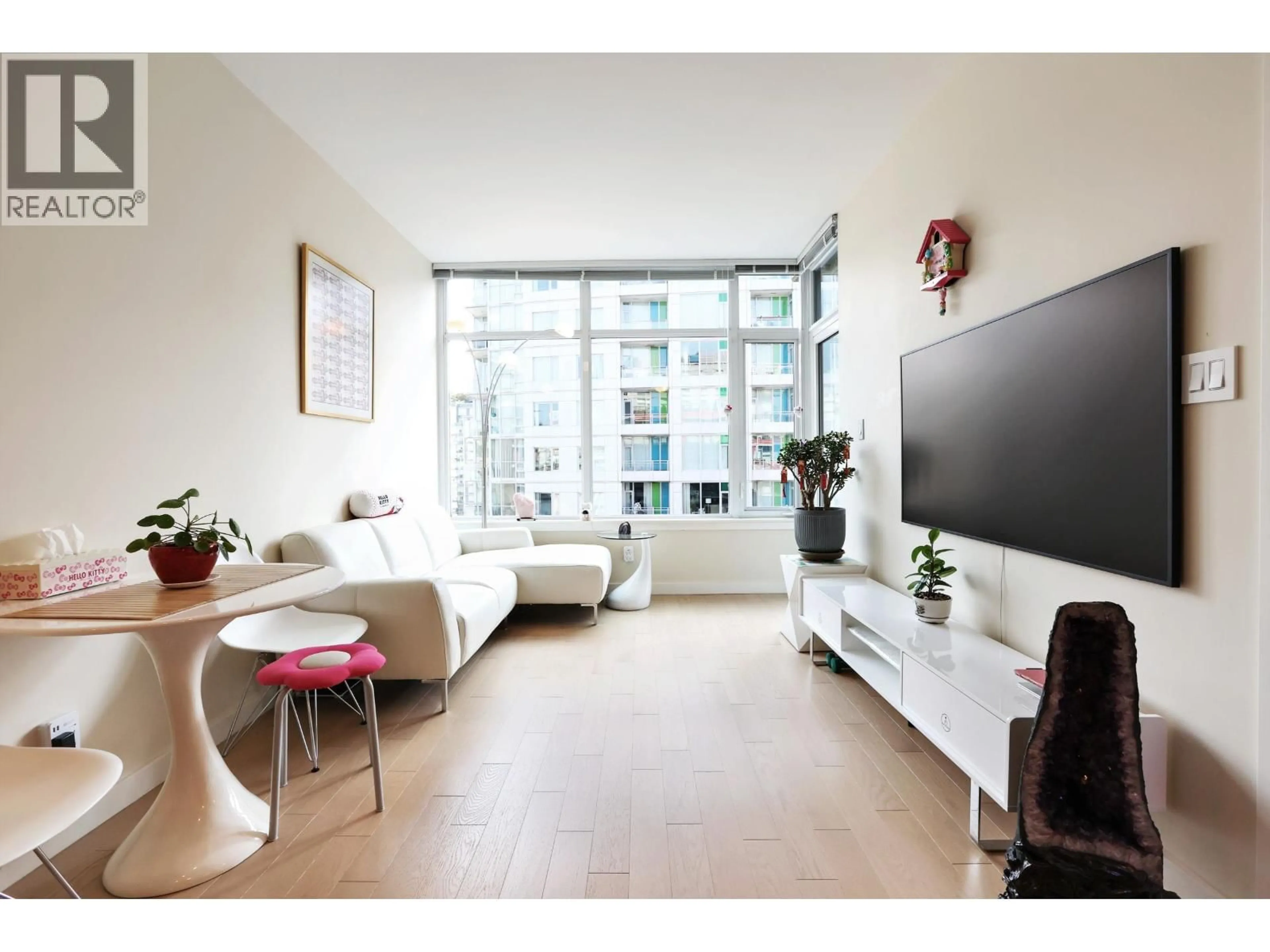 Living room with furniture, wood/laminate floor for 1011 - 38 1ST AVENUE, Vancouver British Columbia V5Y0K3