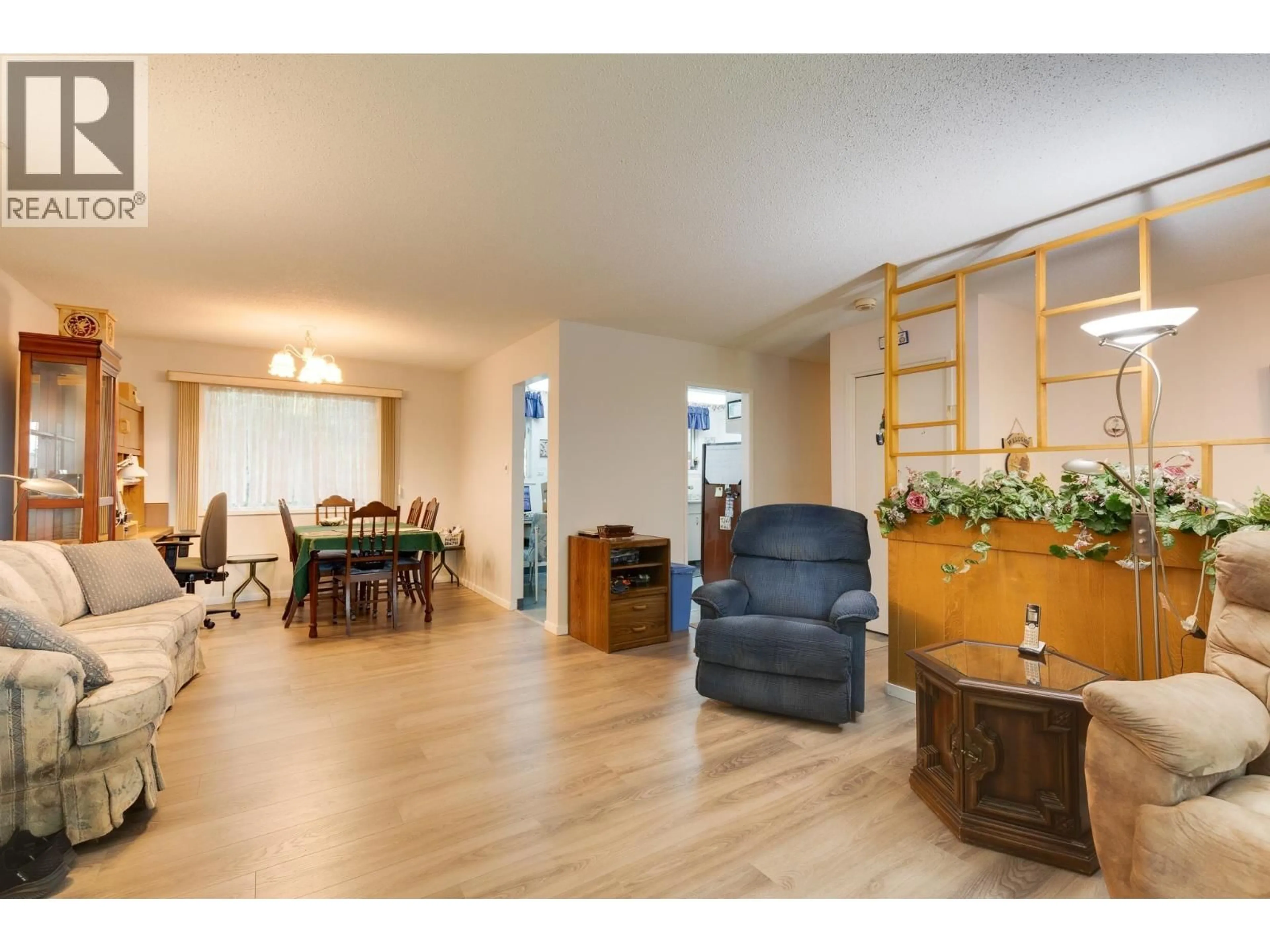 Living room with furniture, wood/laminate floor for 132 MCKENZIE AVENUE, Prince George British Columbia V2L4N4