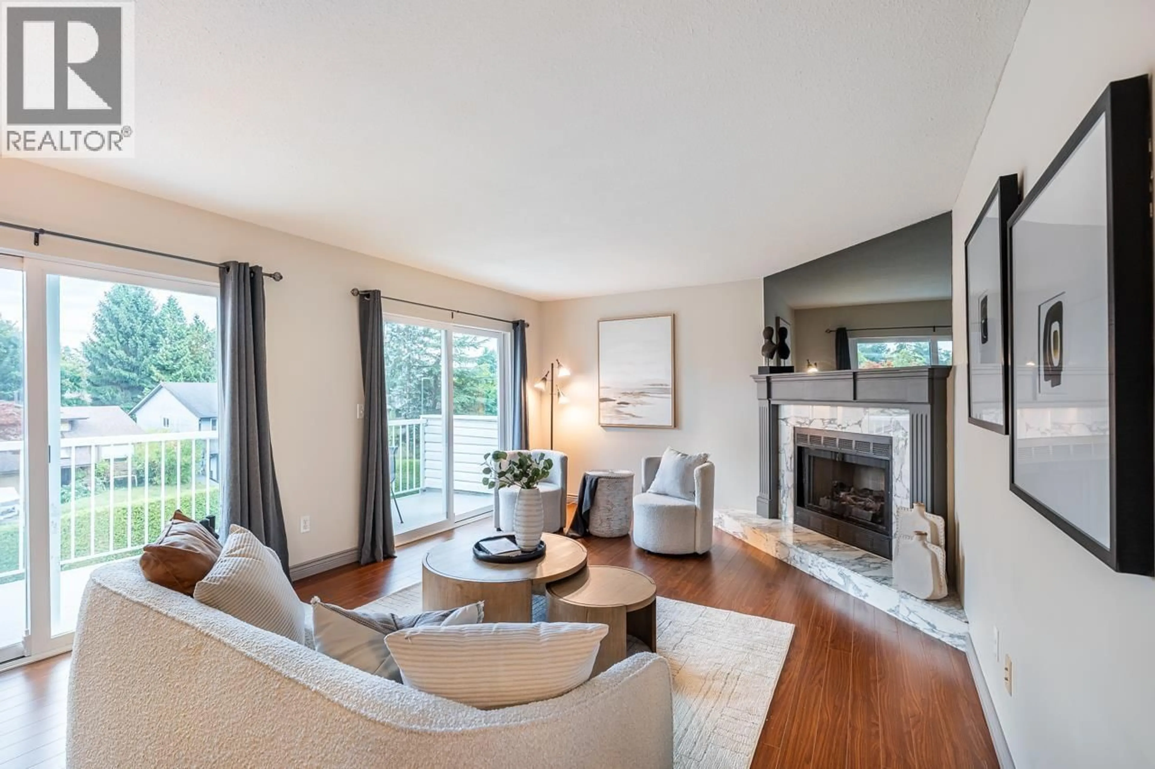 Living room with furniture, wood/laminate floor for 704 - 1180 FALCON DRIVE, Coquitlam British Columbia V3E2K7