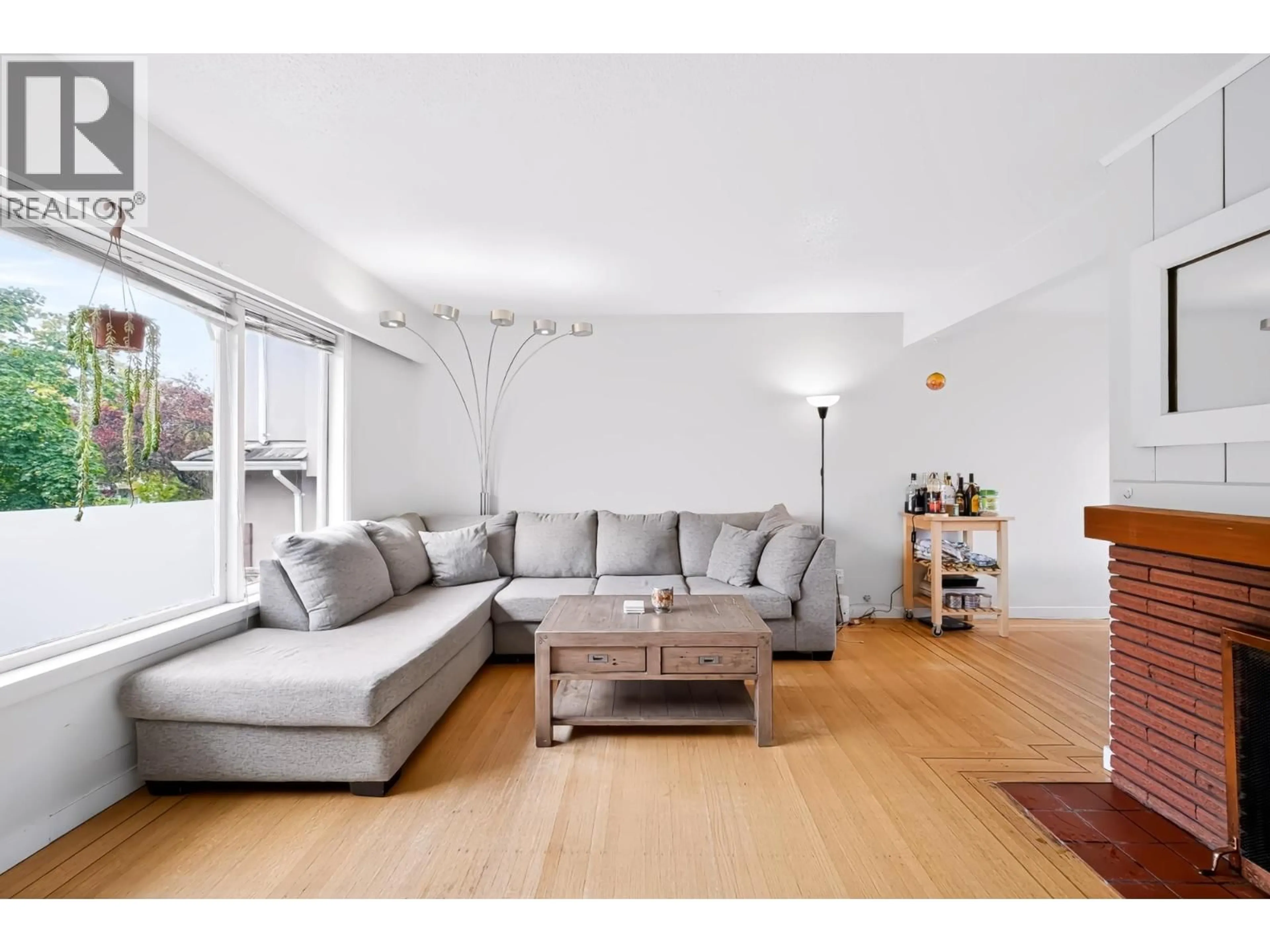 Living room with furniture, wood/laminate floor for 1685 55TH AVENUE, Vancouver British Columbia V5P1Z4