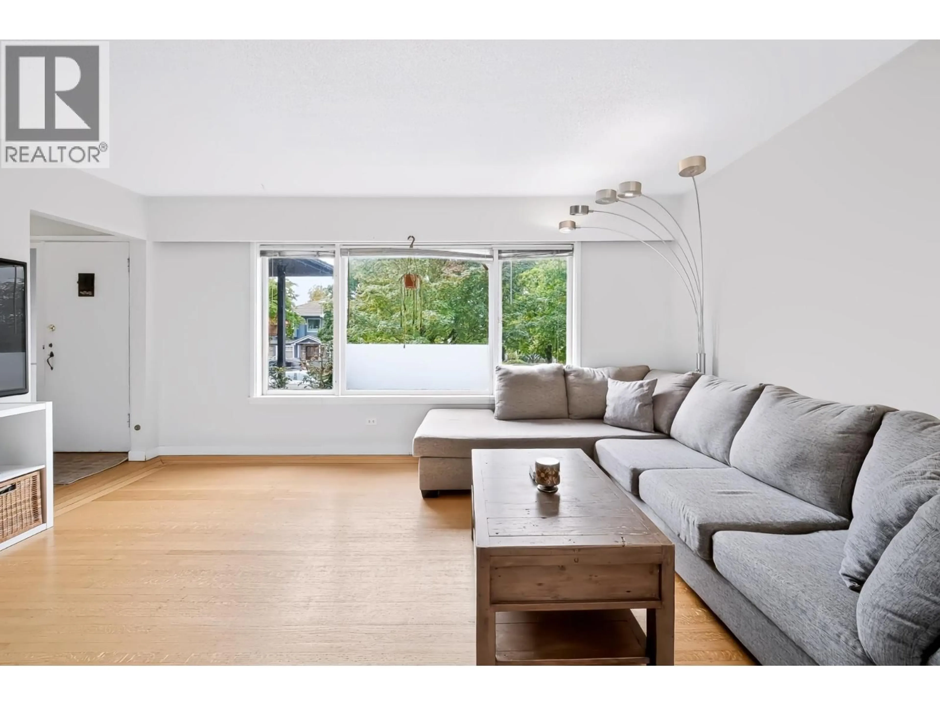 Living room with furniture, wood/laminate floor for 1685 55TH AVENUE, Vancouver British Columbia V5P1Z4
