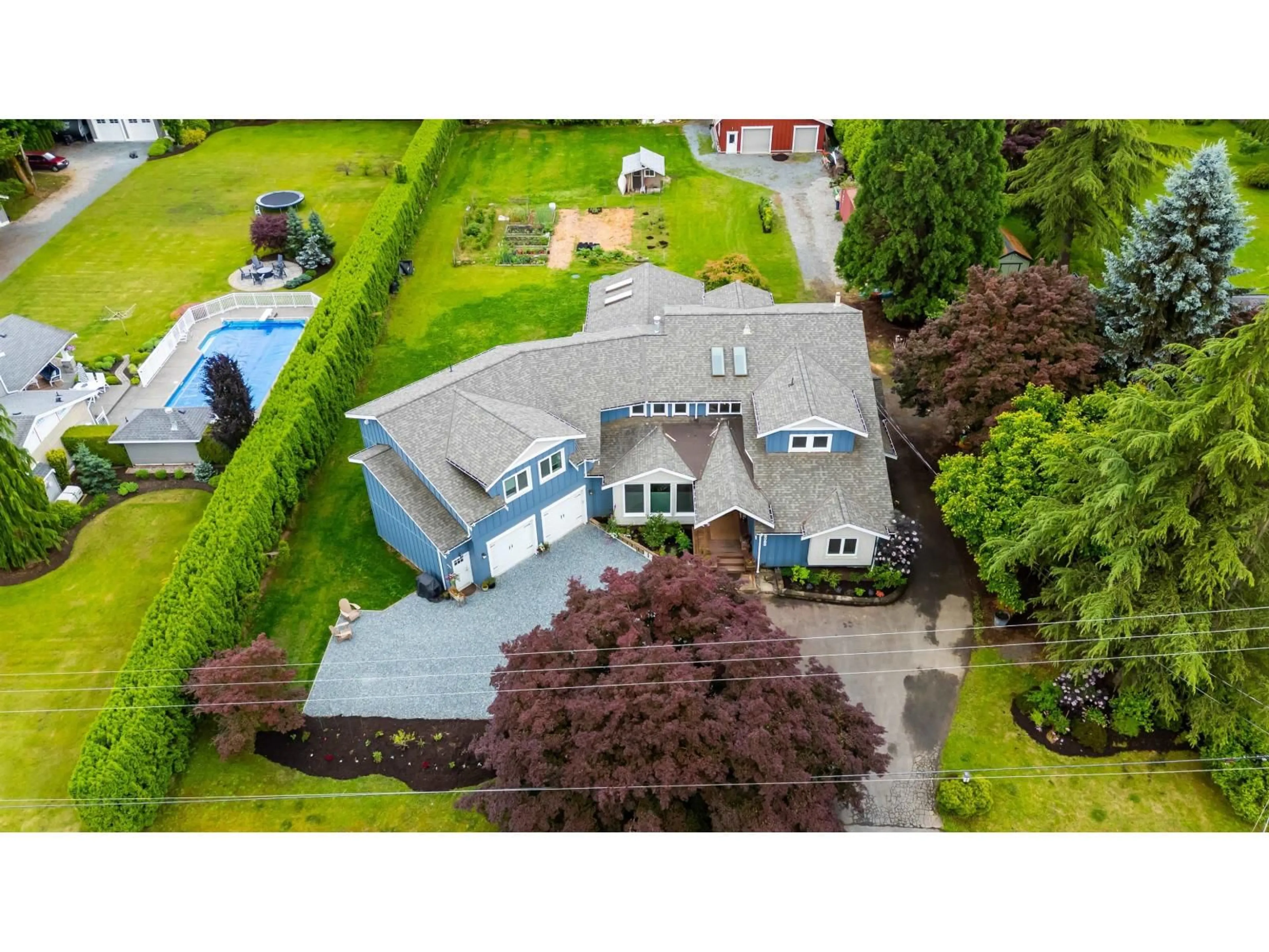 A pic from outside/outdoor area/front of a property/back of a property/a pic from drone, building for 25088 59 AVENUE, Langley British Columbia V4W1T4