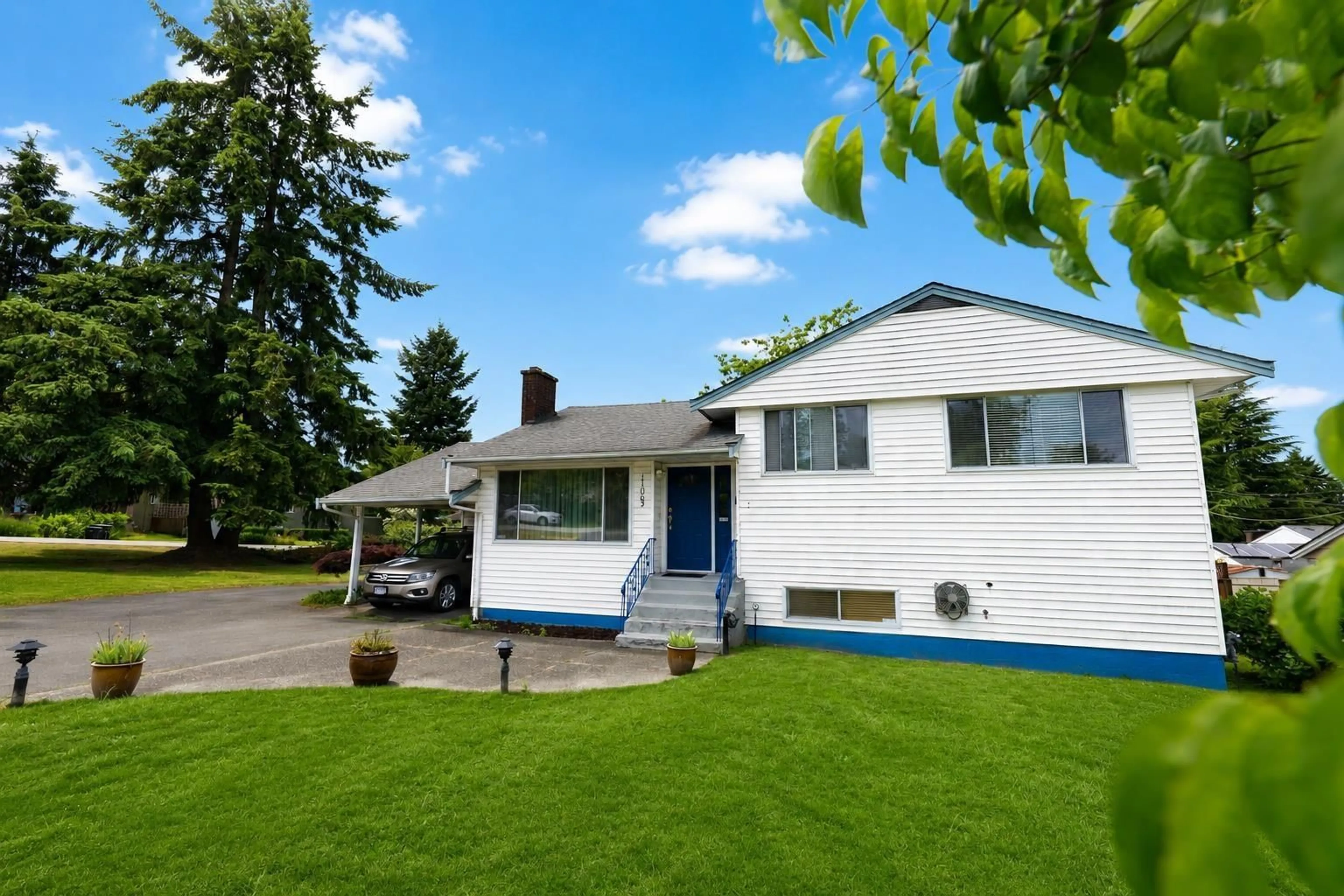 Home with vinyl exterior material, street for 11063 135A STREET, Surrey British Columbia V3R3A6
