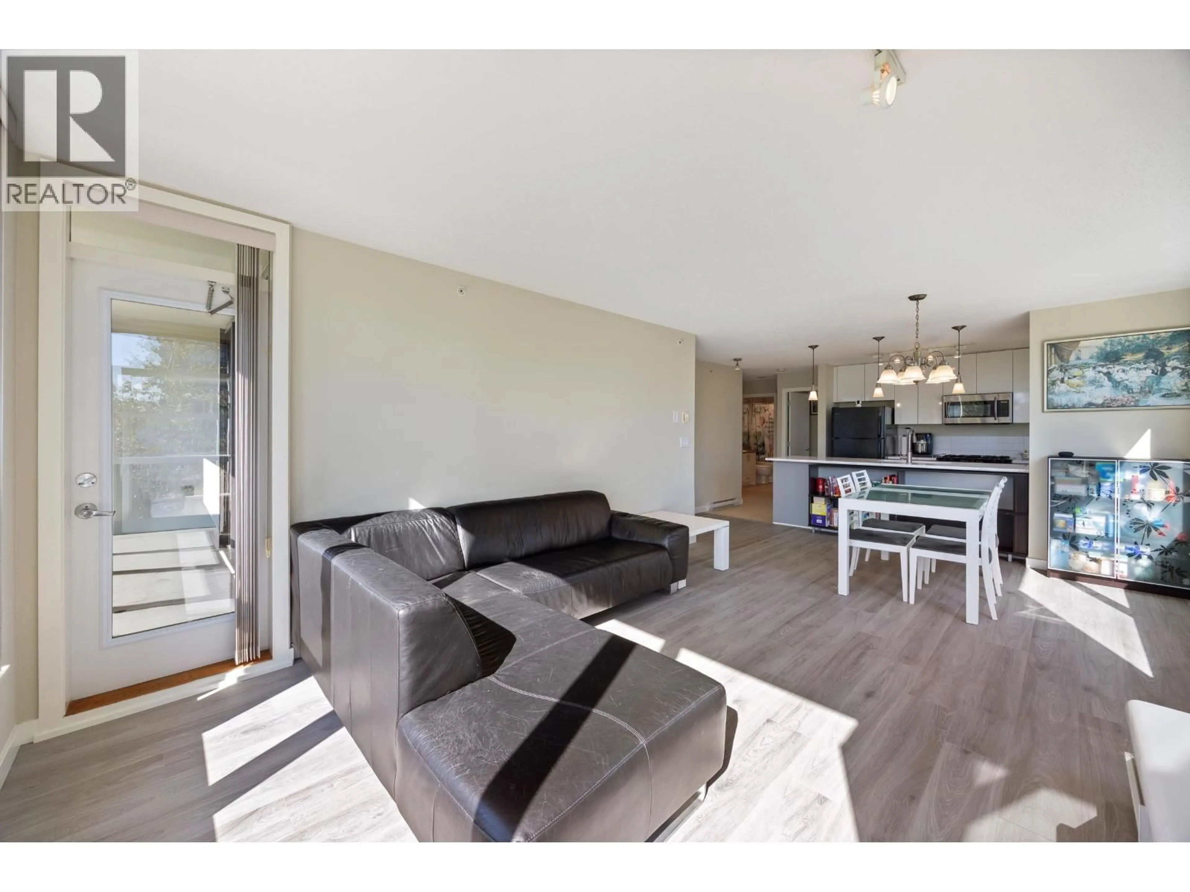 Living room with furniture, wood/laminate floor for 307 - 7108 COLLIER STREET, Burnaby British Columbia V5E0A1