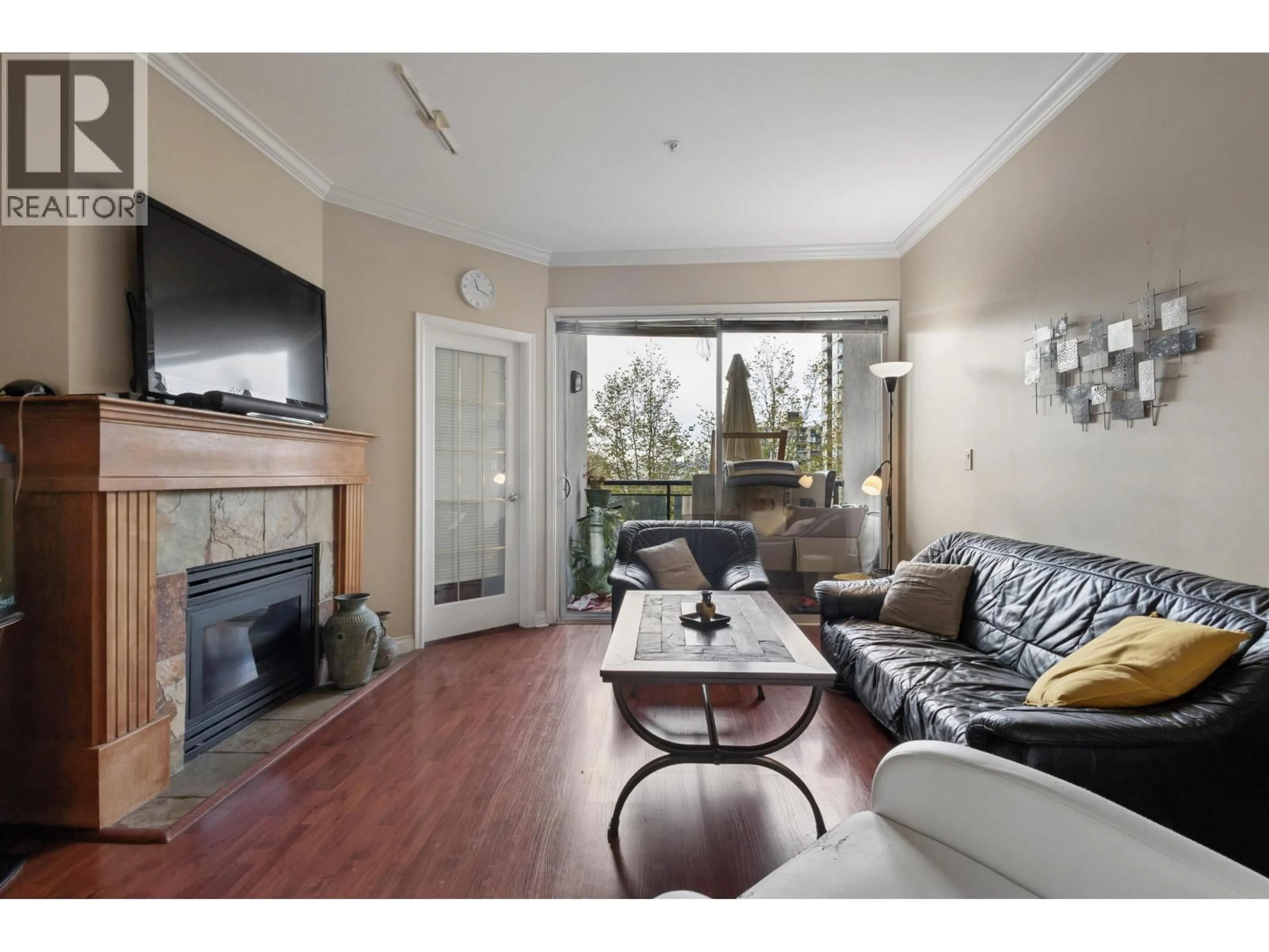 Living room with furniture, wood/laminate floor for 302 - 131 3RD STREET, North Vancouver British Columbia V7M1E7