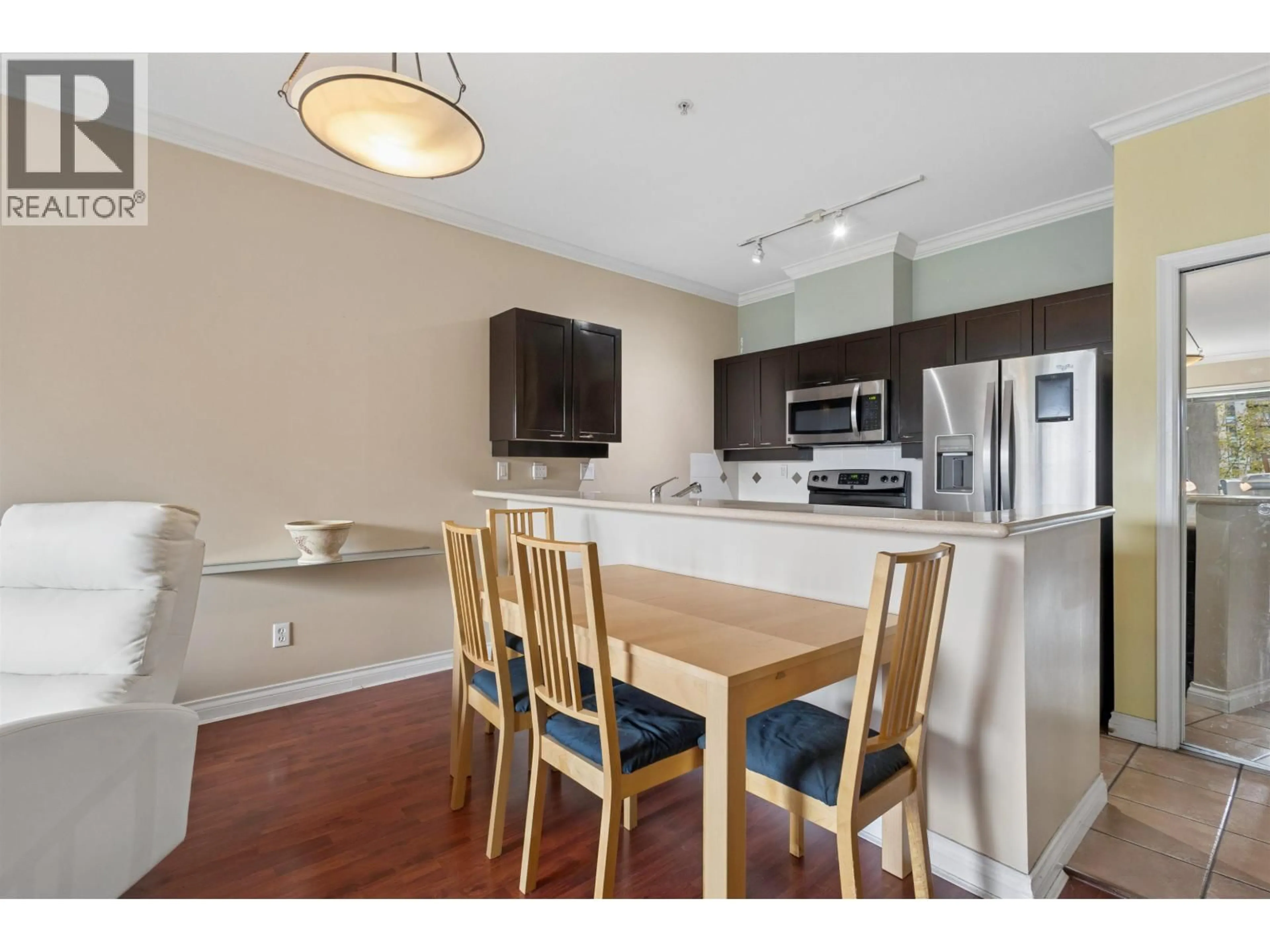 Open concept kitchen, wood/laminate floor for 302 - 131 3RD STREET, North Vancouver British Columbia V7M1E7