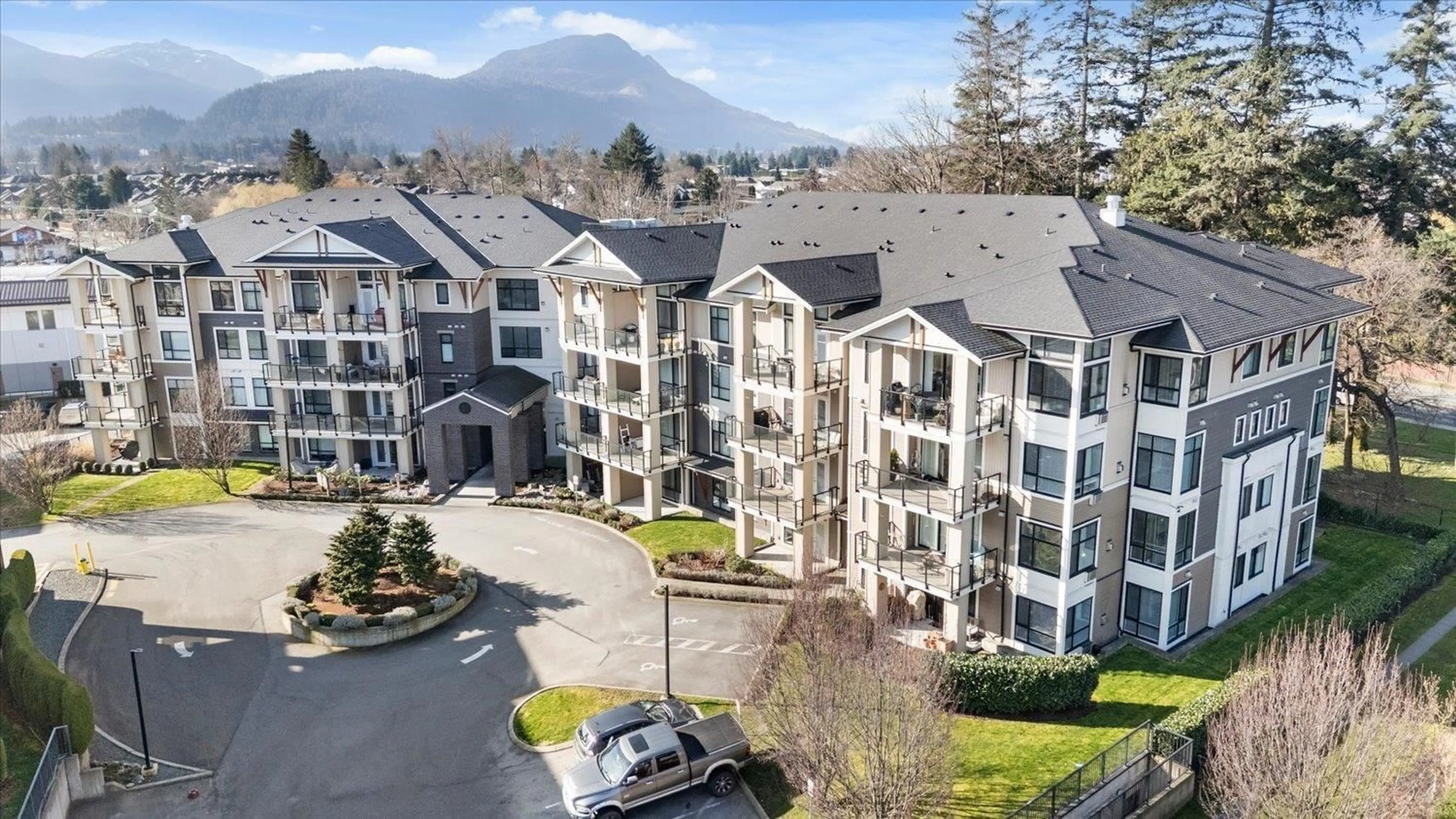 A pic from outside/outdoor area/front of a property/back of a property/a pic from drone, mountain view for 102 - 45761 STEVENSON ROAD, Chilliwack British Columbia V2R0Y7