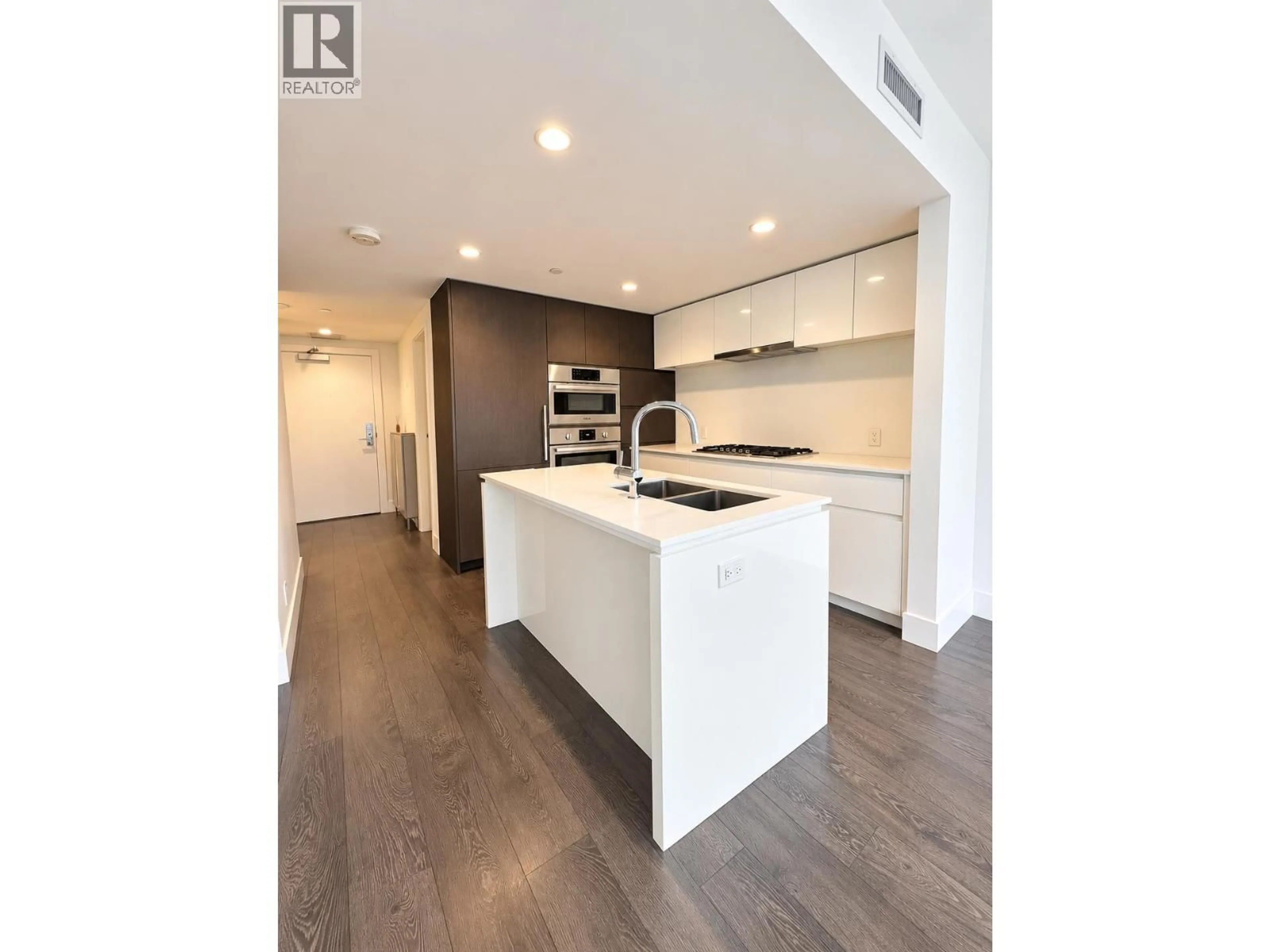 Open concept kitchen, wood/laminate floor for 513 - 6900 PEARSON WAY, Richmond British Columbia V7C0C9