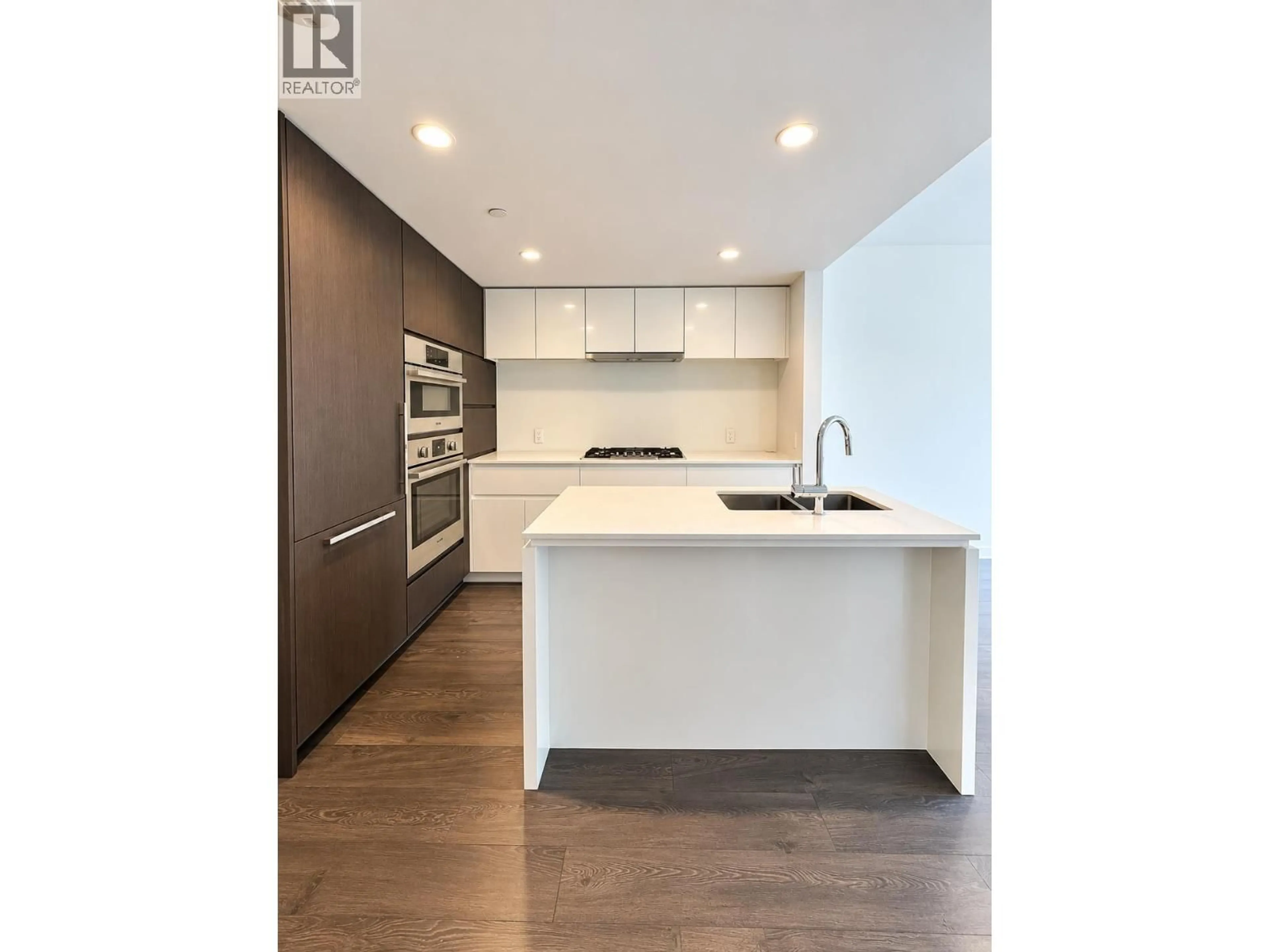 Open concept kitchen, wood/laminate floor for 513 - 6900 PEARSON WAY, Richmond British Columbia V7C0C9