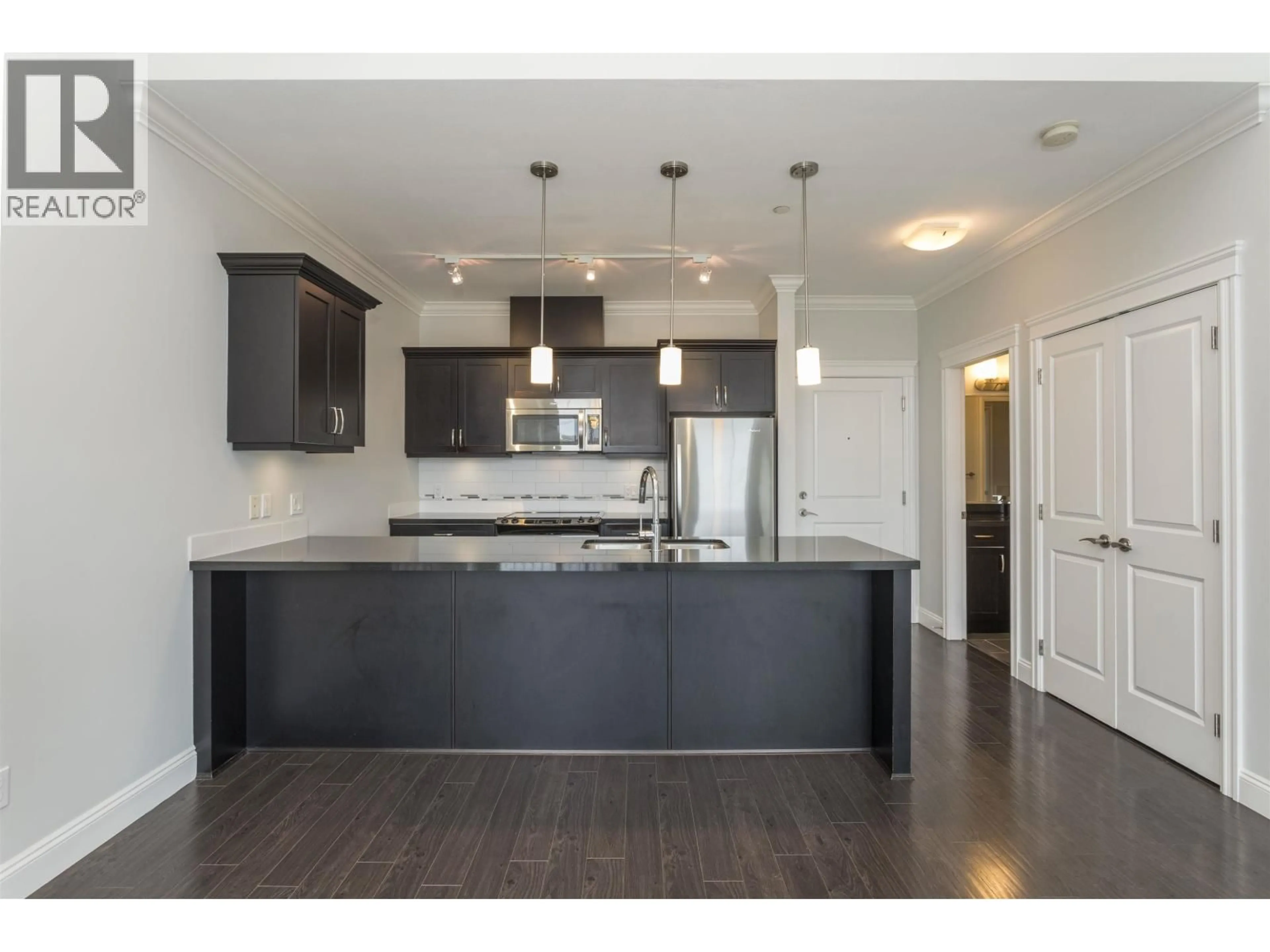 Open concept kitchen, wood/laminate floor for 415 - 11882 226 STREET, Maple Ridge British Columbia V2X9C7