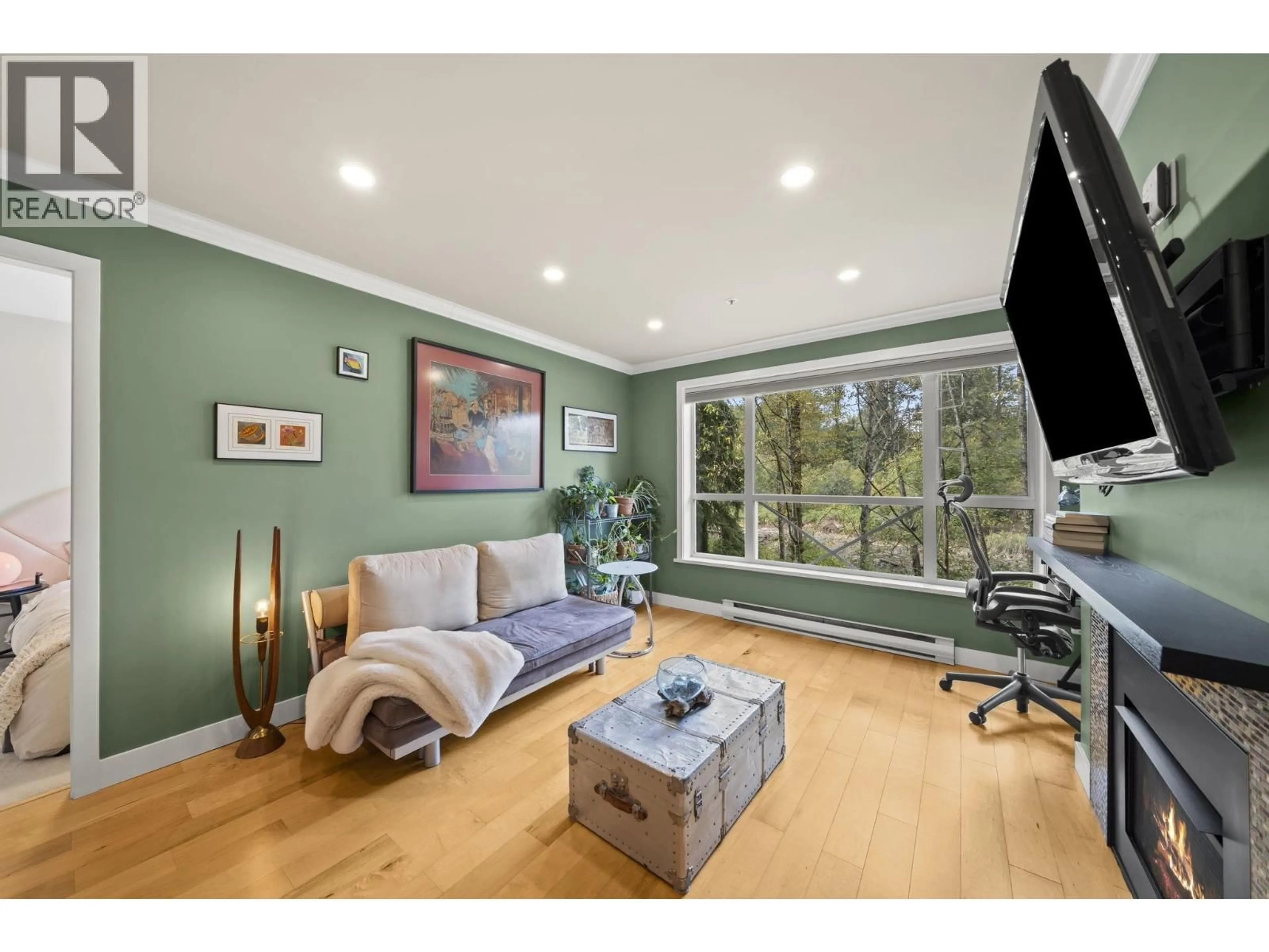 Living room with furniture, wood/laminate floor for 217 - 2551 PARVIEW LANE, Port Coquitlam British Columbia V3C6J8