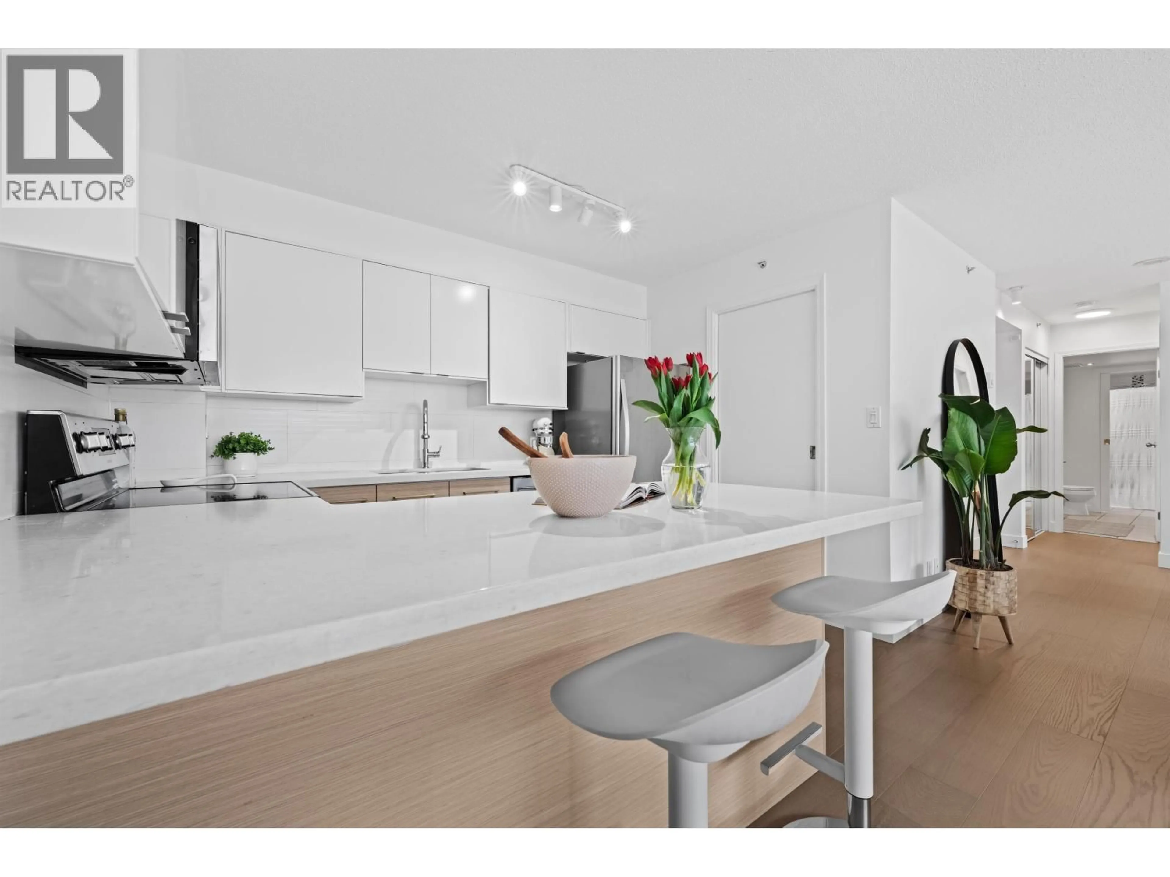 Open concept kitchen, wood/laminate floor for 204 - 1633 8TH AVENUE, Vancouver British Columbia V6J5H7
