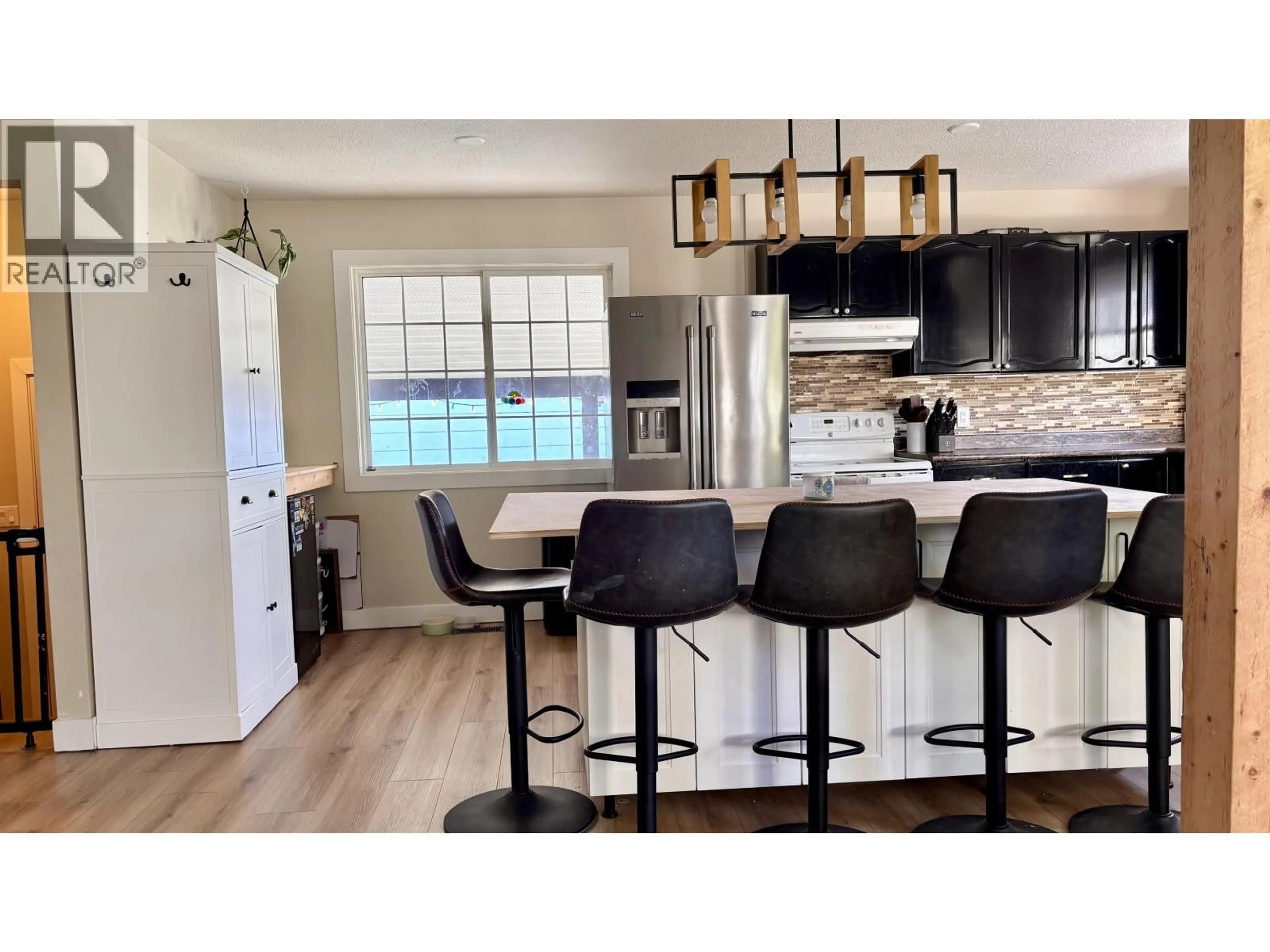 Open concept kitchen, wood/laminate floor for 40 DEASE STREET, Kitimat British Columbia V8C2M6
