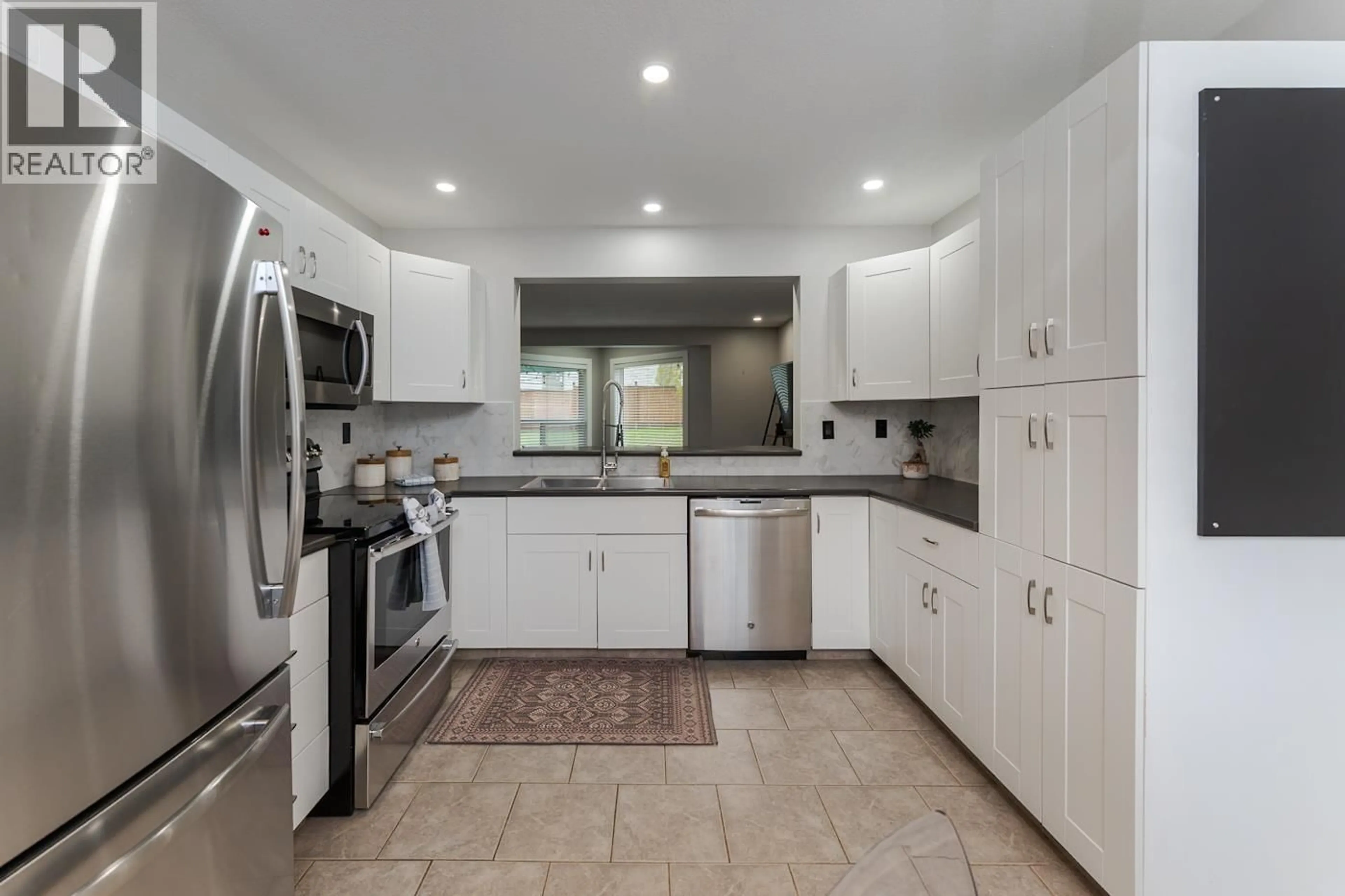 Open concept kitchen, ceramic/tile floor for 117 - 3233 MCGILL CRESCENT, Prince George British Columbia V2N2T4