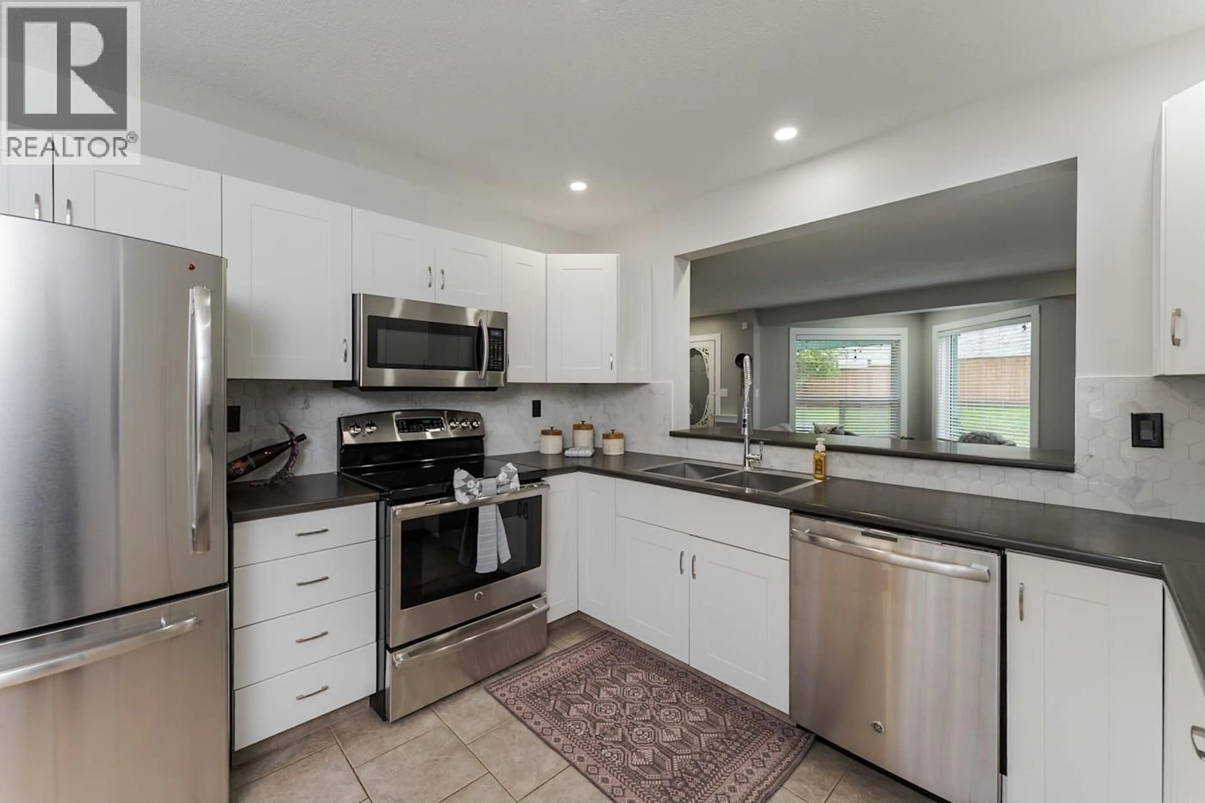 Open concept kitchen, ceramic/tile floor for 117 - 3233 MCGILL CRESCENT, Prince George British Columbia V2N2T4