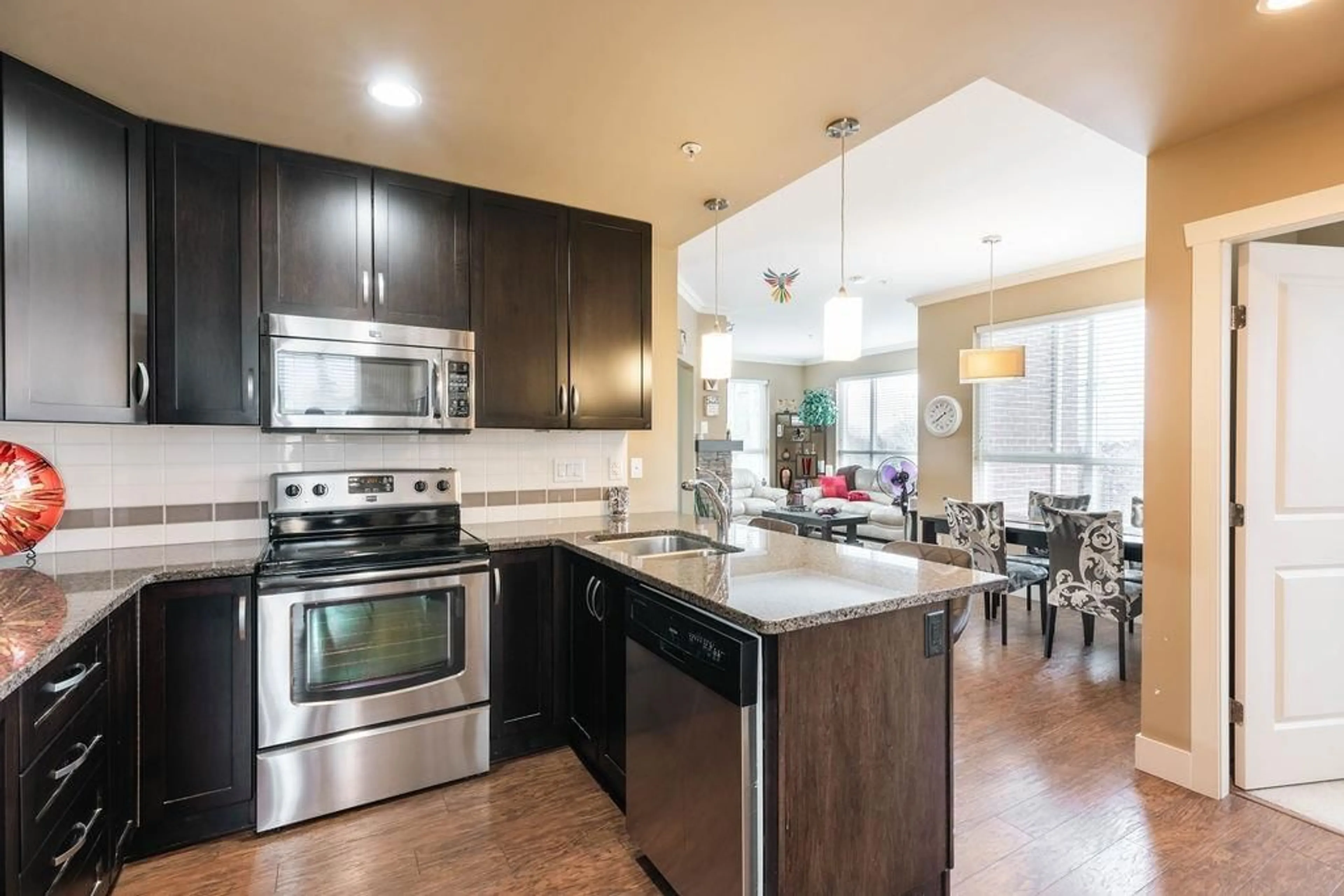 Open concept kitchen, unknown for 203 - 3192 GLADWIN ROAD, Abbotsford British Columbia V2T6M9