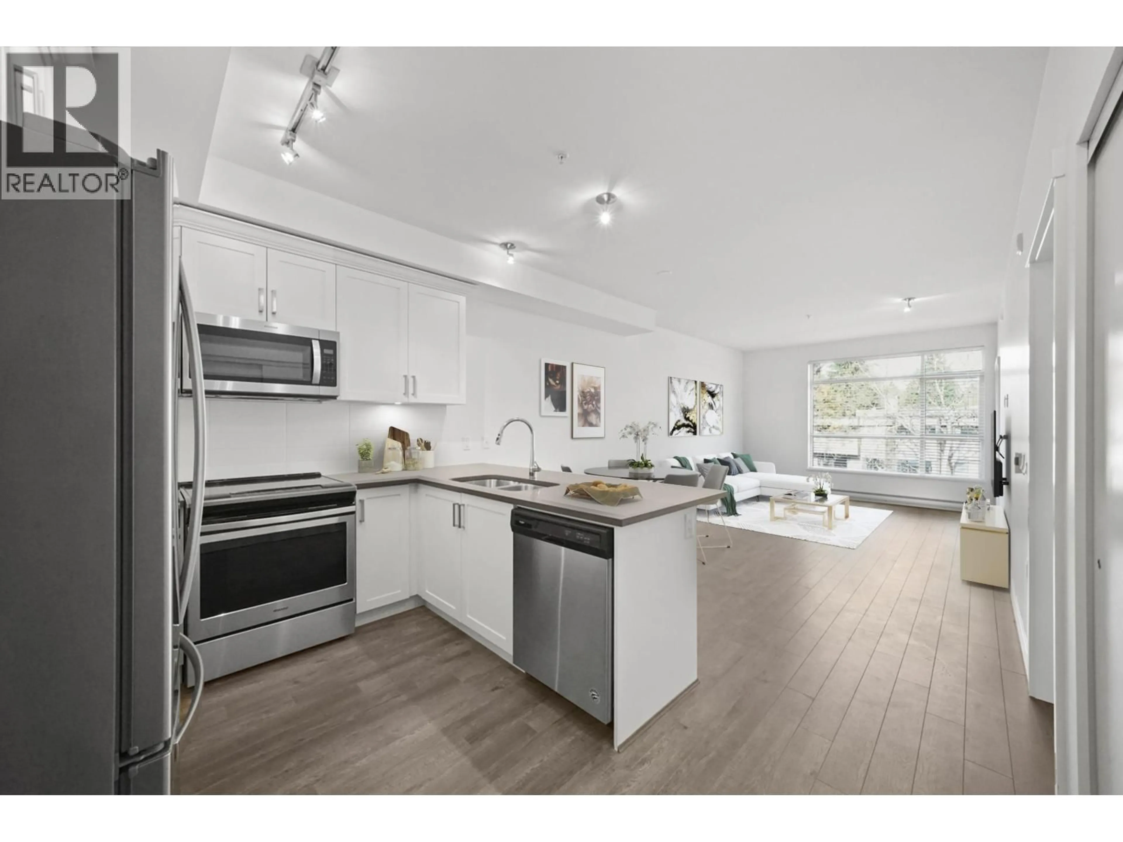 Open concept kitchen, wood/laminate floor for 304 - 2436 KELLY AVENUE, Port Coquitlam British Columbia V3C1Y4