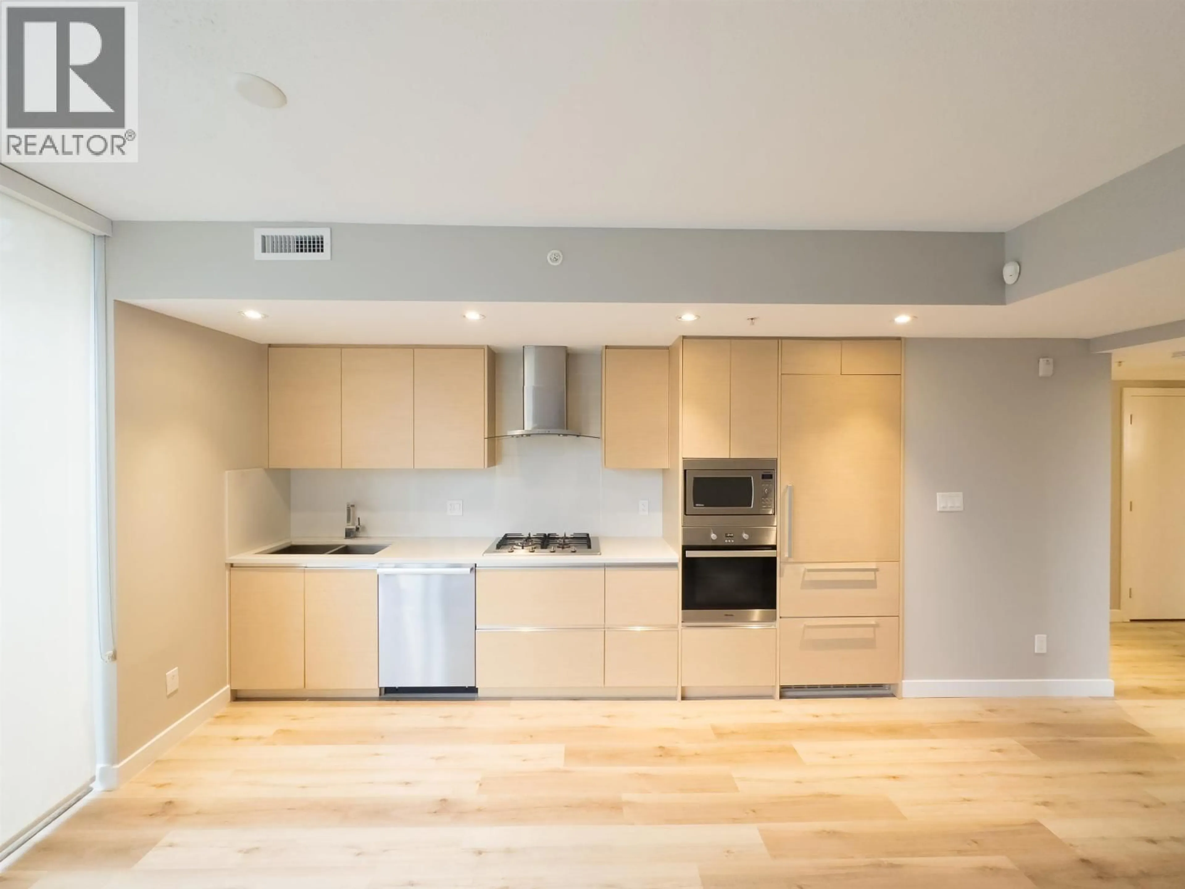 Open concept kitchen, wood/laminate floor for 101 - 4539 CAMBIE STREET, Vancouver British Columbia V5Z2Z1