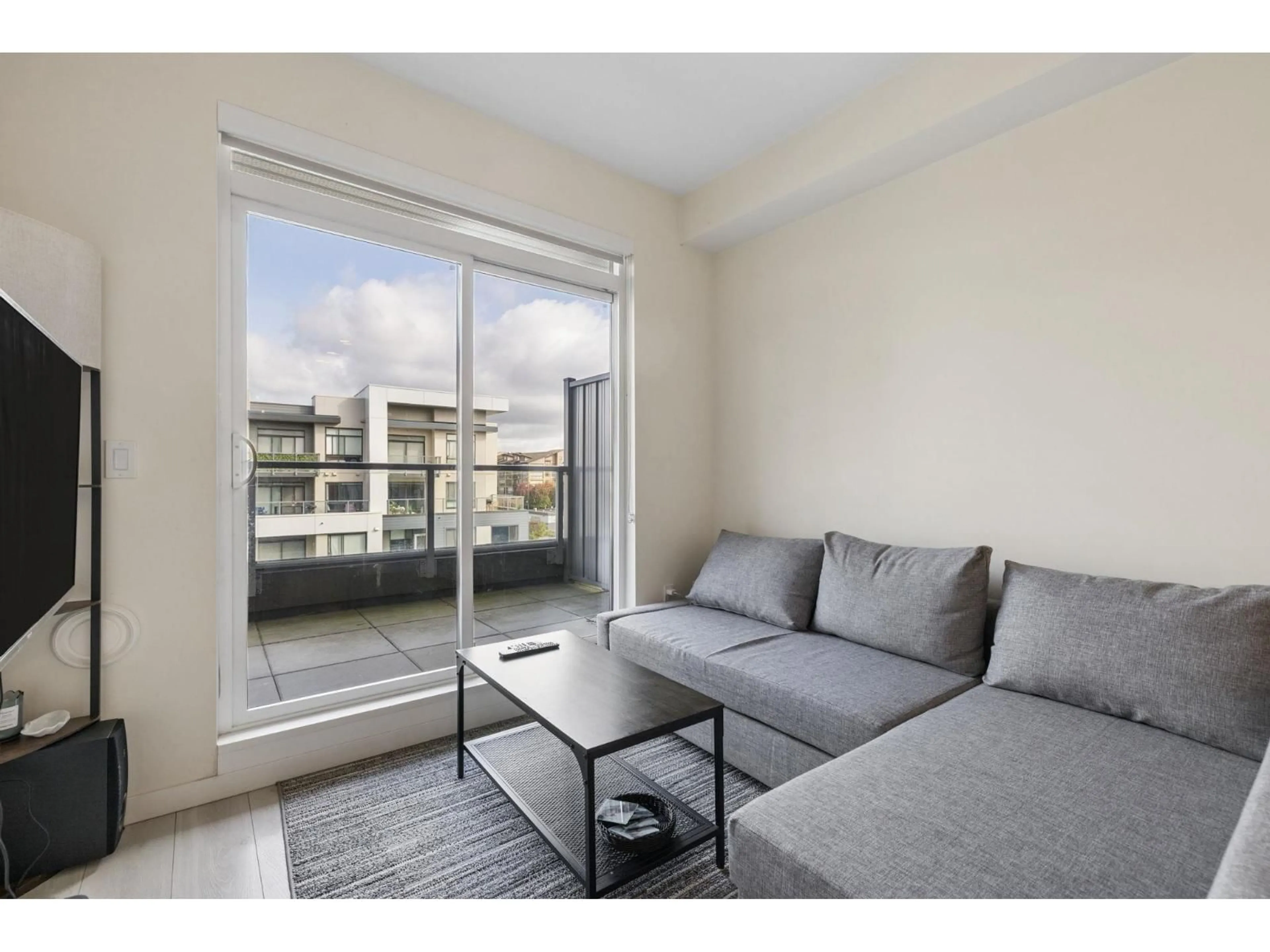 Living room with furniture, wood/laminate floor for 504 - 7920 206 STREET, Langley British Columbia V2Y3X1