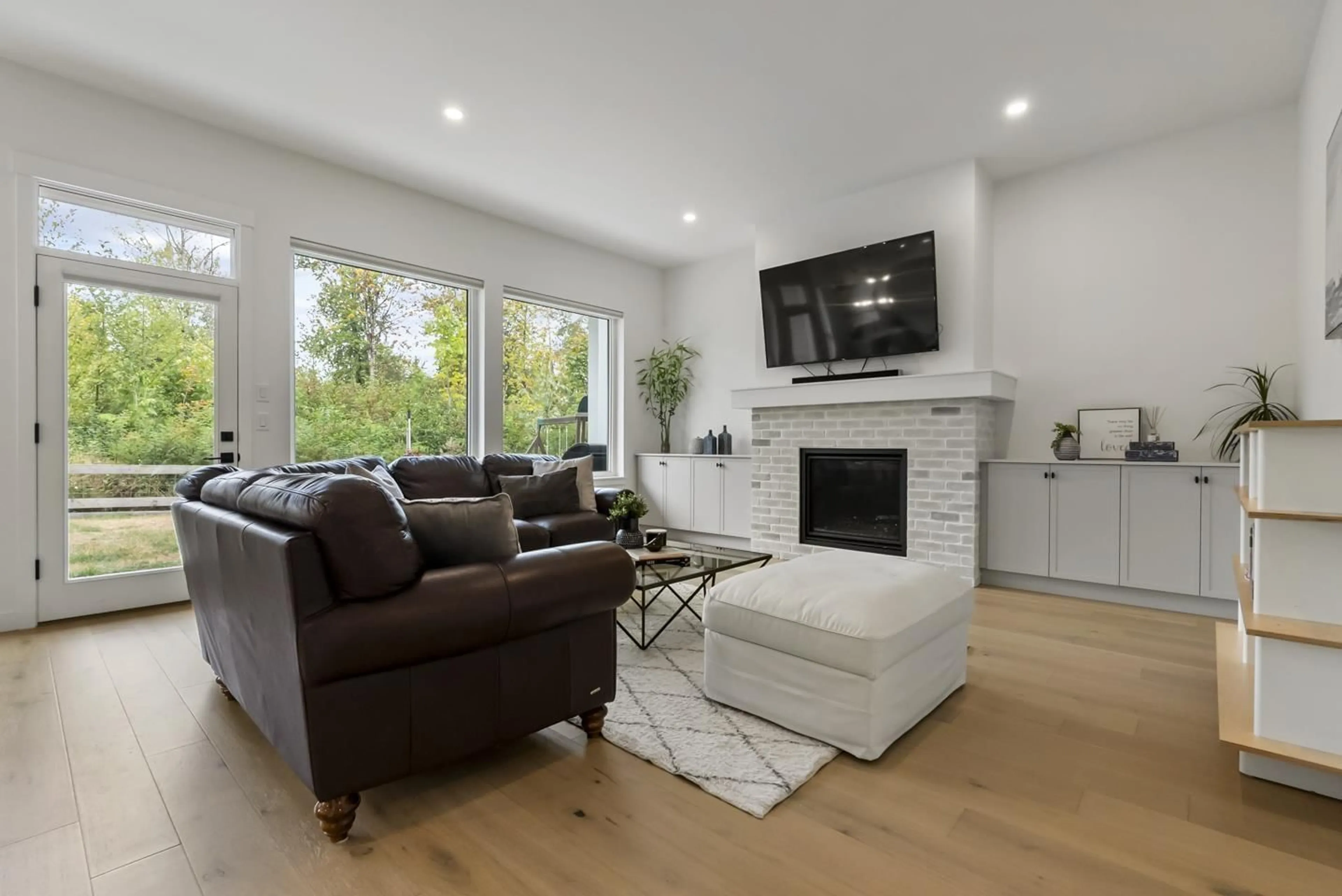 Living room with furniture, wood/laminate floor for 7567 196A STREET, Langley British Columbia V2Y3T2