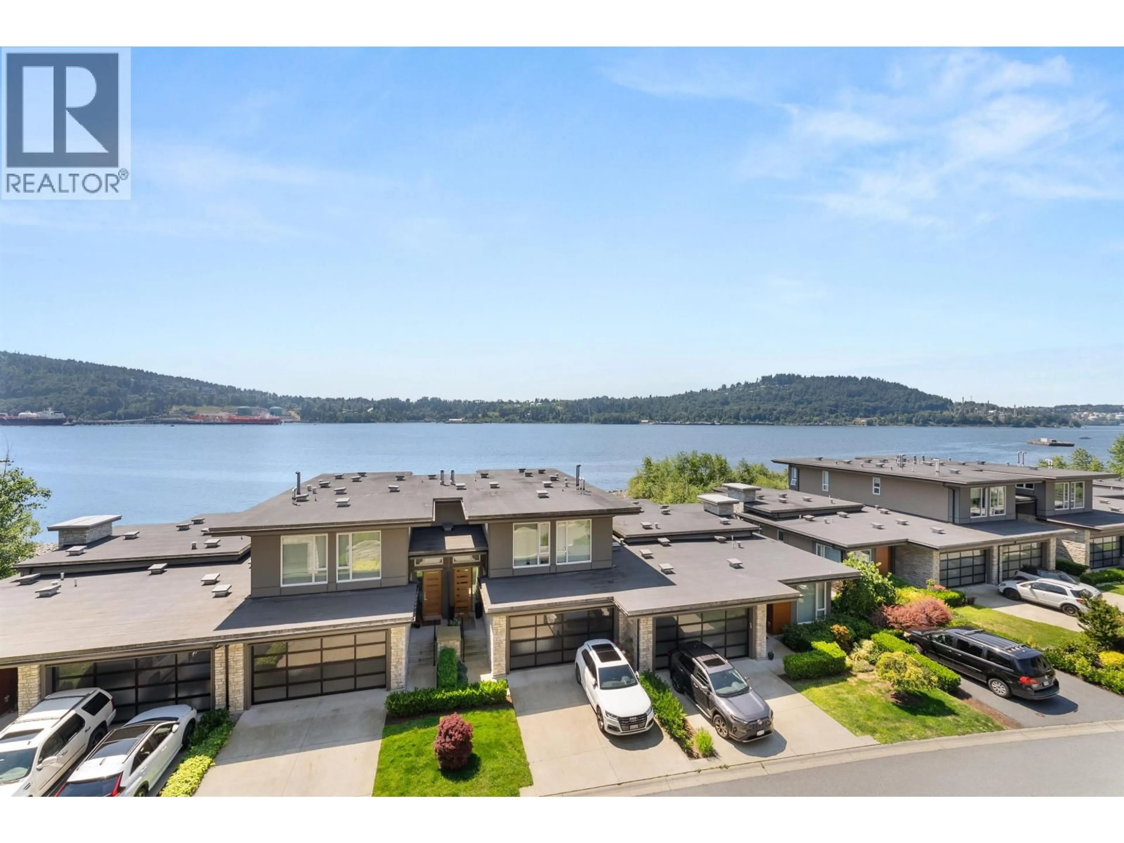 A pic from outside/outdoor area/front of a property/back of a property/a pic from drone, water/lake/river/ocean view for 305 - 3911 CATES LANDING WAY, North Vancouver British Columbia V7G0A6