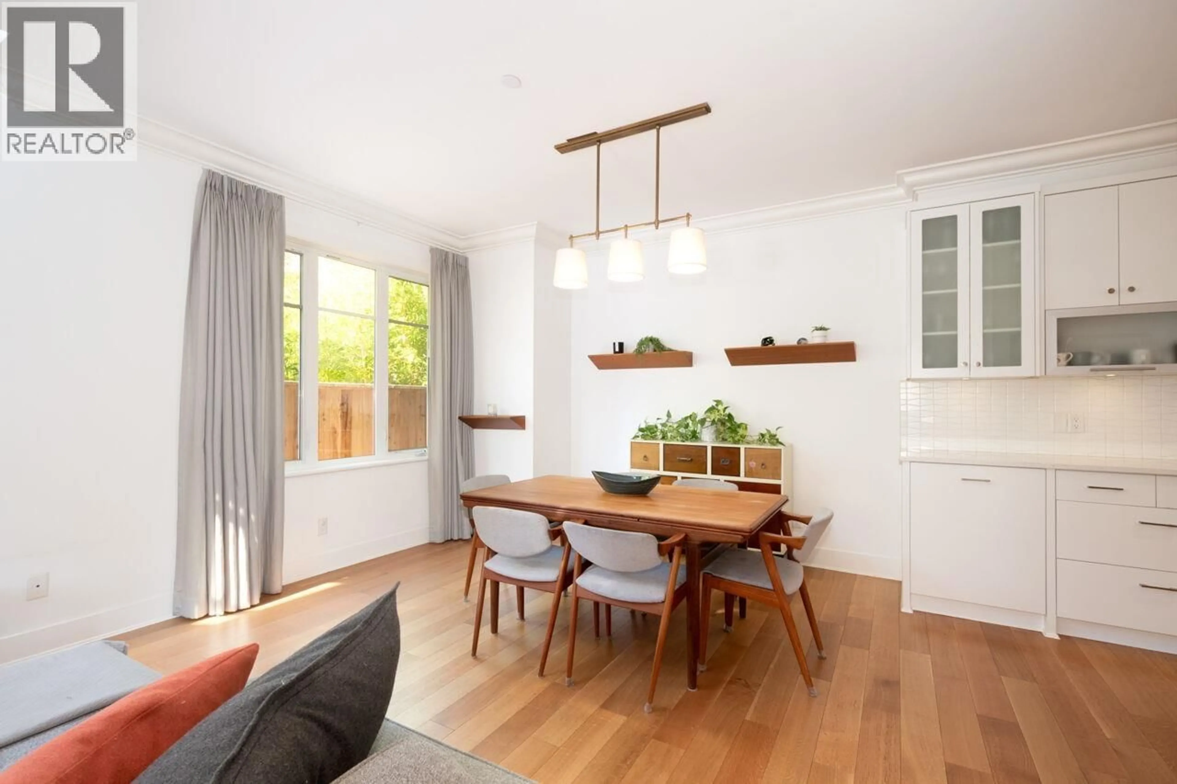 Dining room, wood/laminate floor for 3485 2ND AVENUE, Vancouver British Columbia V6R1J3