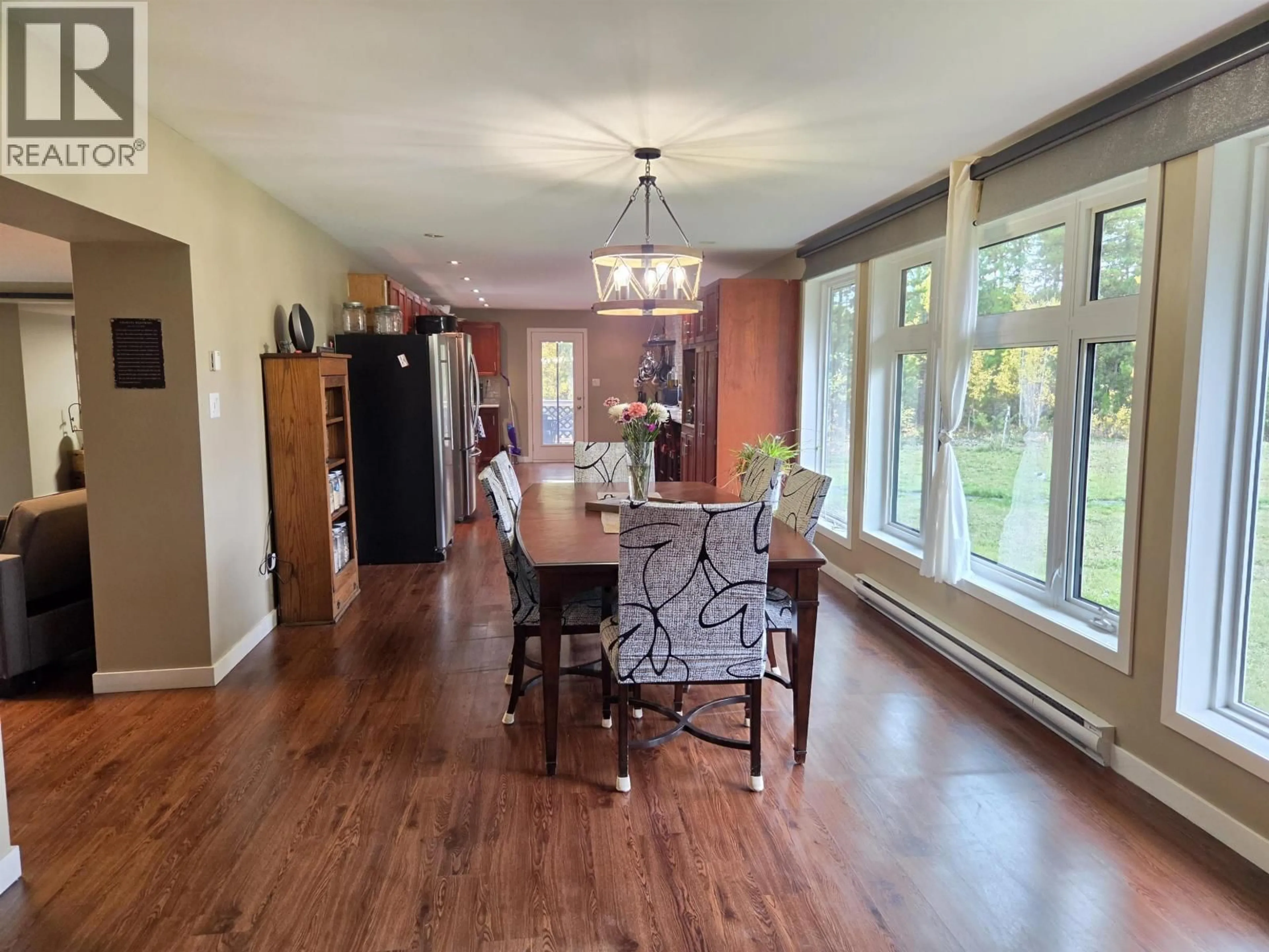 Dining room, wood/laminate floor for 54325 JARDINE ROAD, Cluculz Lake British Columbia V0J3A3
