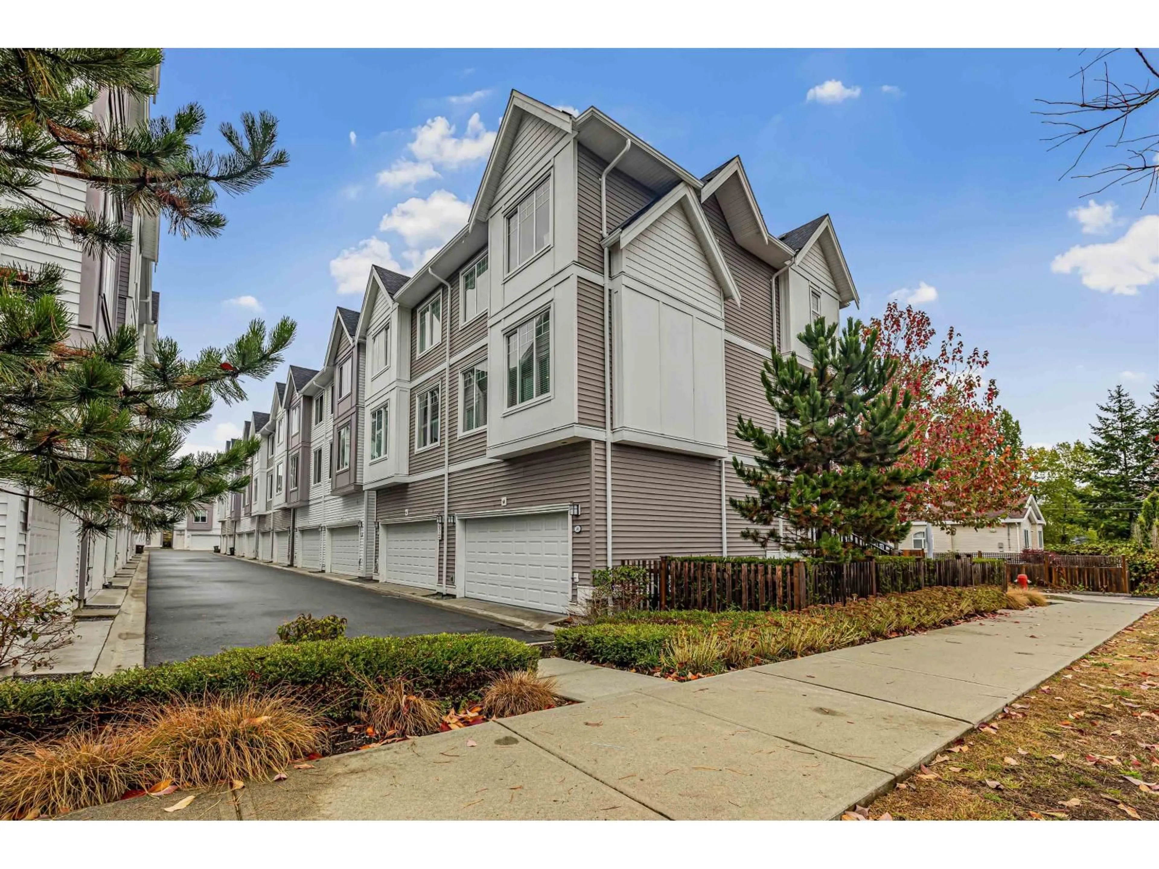 A pic from outside/outdoor area/front of a property/back of a property/a pic from drone, street for 20 - 8033 166B STREET, Surrey British Columbia V4N6G7