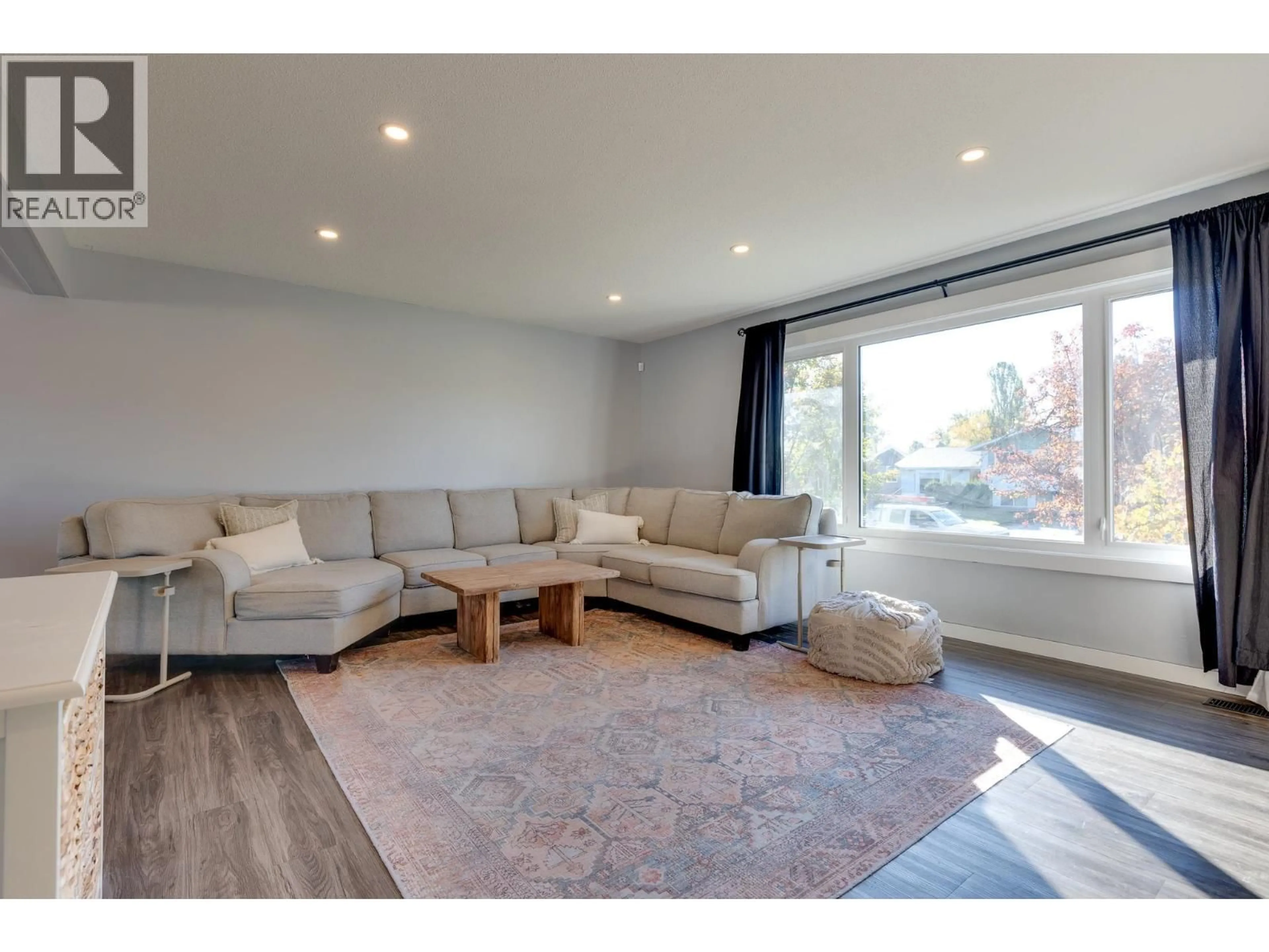 Living room with furniture, wood/laminate floor for 534 RUNNALLS AVENUE, Prince George British Columbia V2N1Y9