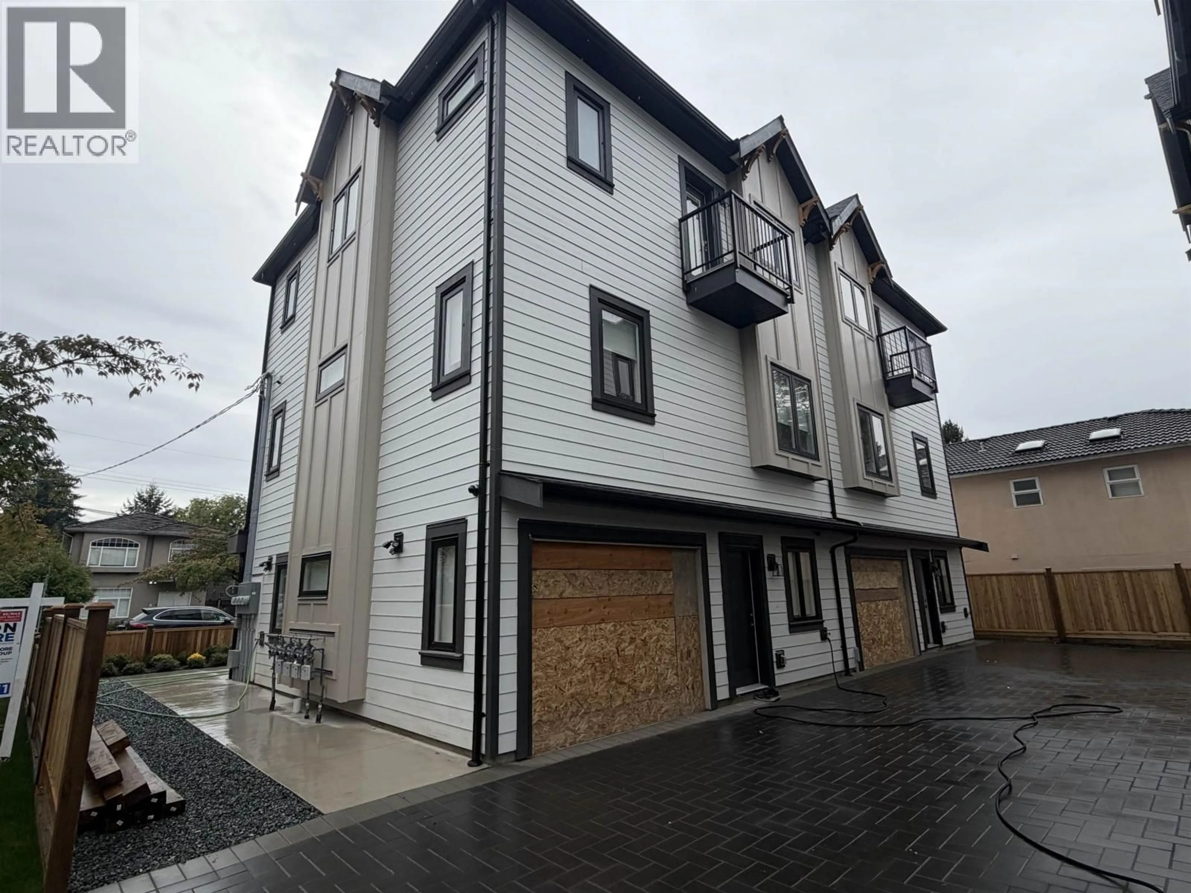 A pic from outside/outdoor area/front of a property/back of a property/a pic from drone, street for 2 - 7497 HOLLY STREET, Burnaby British Columbia V5E2C3