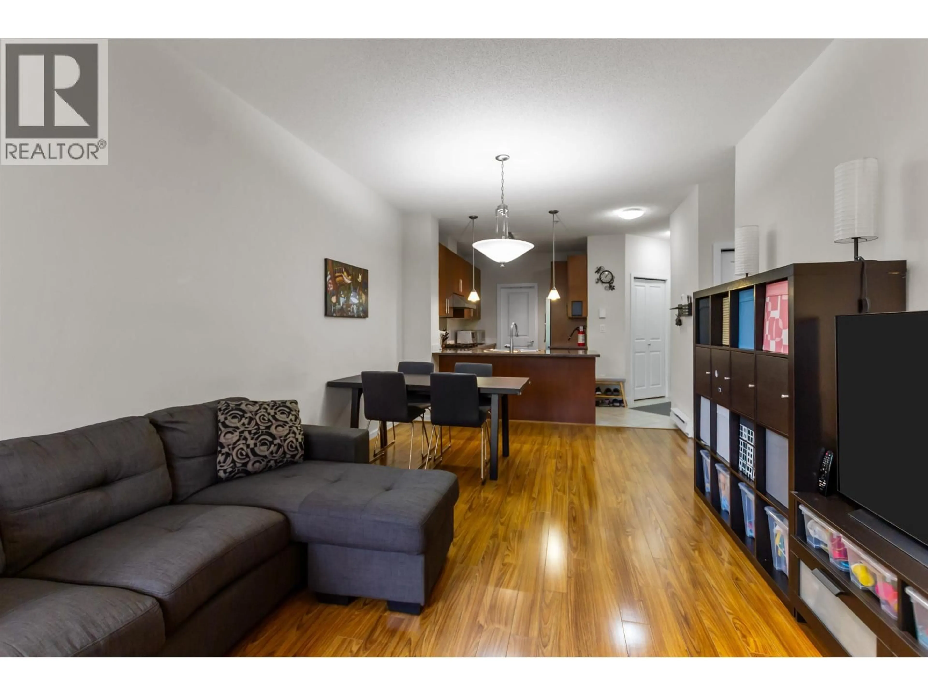 Living room with furniture, wood/laminate floor for 408 - 3651 FOSTER AVENUE, Vancouver British Columbia V5R0A2