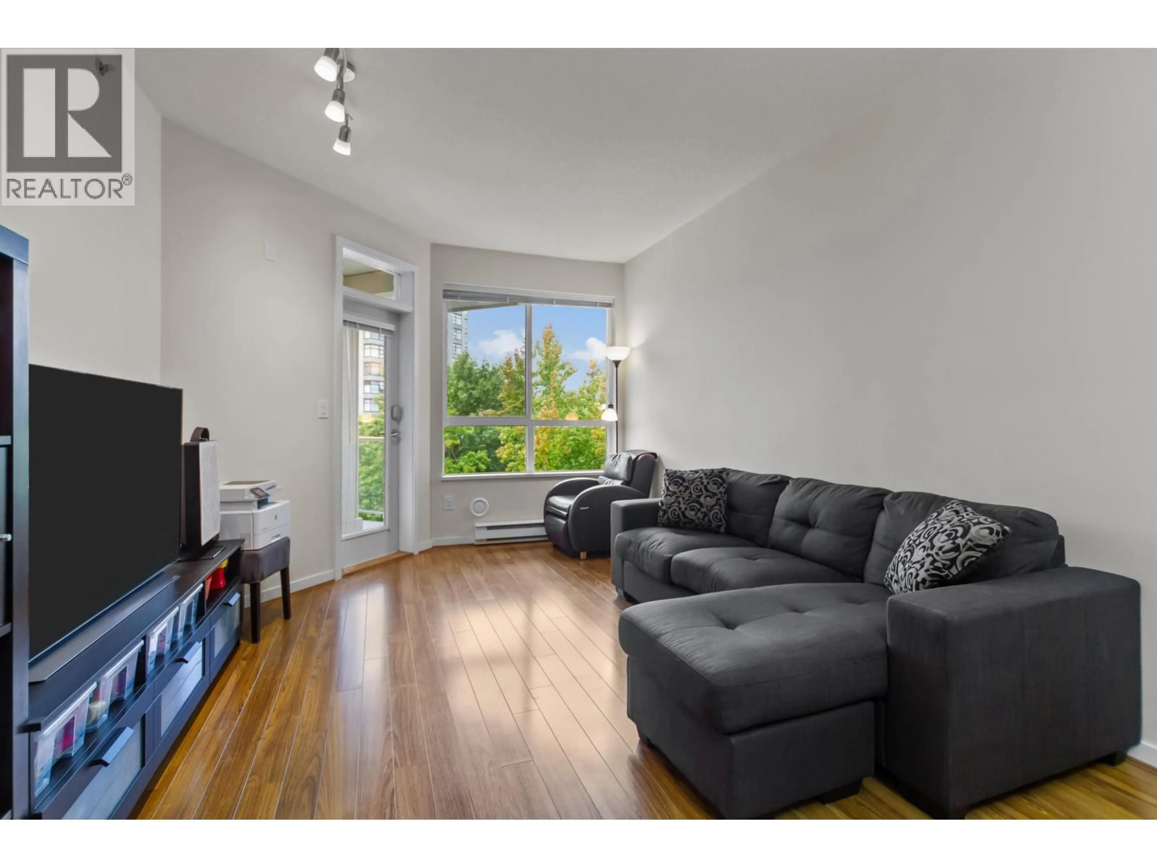Living room with furniture, wood/laminate floor for 408 - 3651 FOSTER AVENUE, Vancouver British Columbia V5R0A2