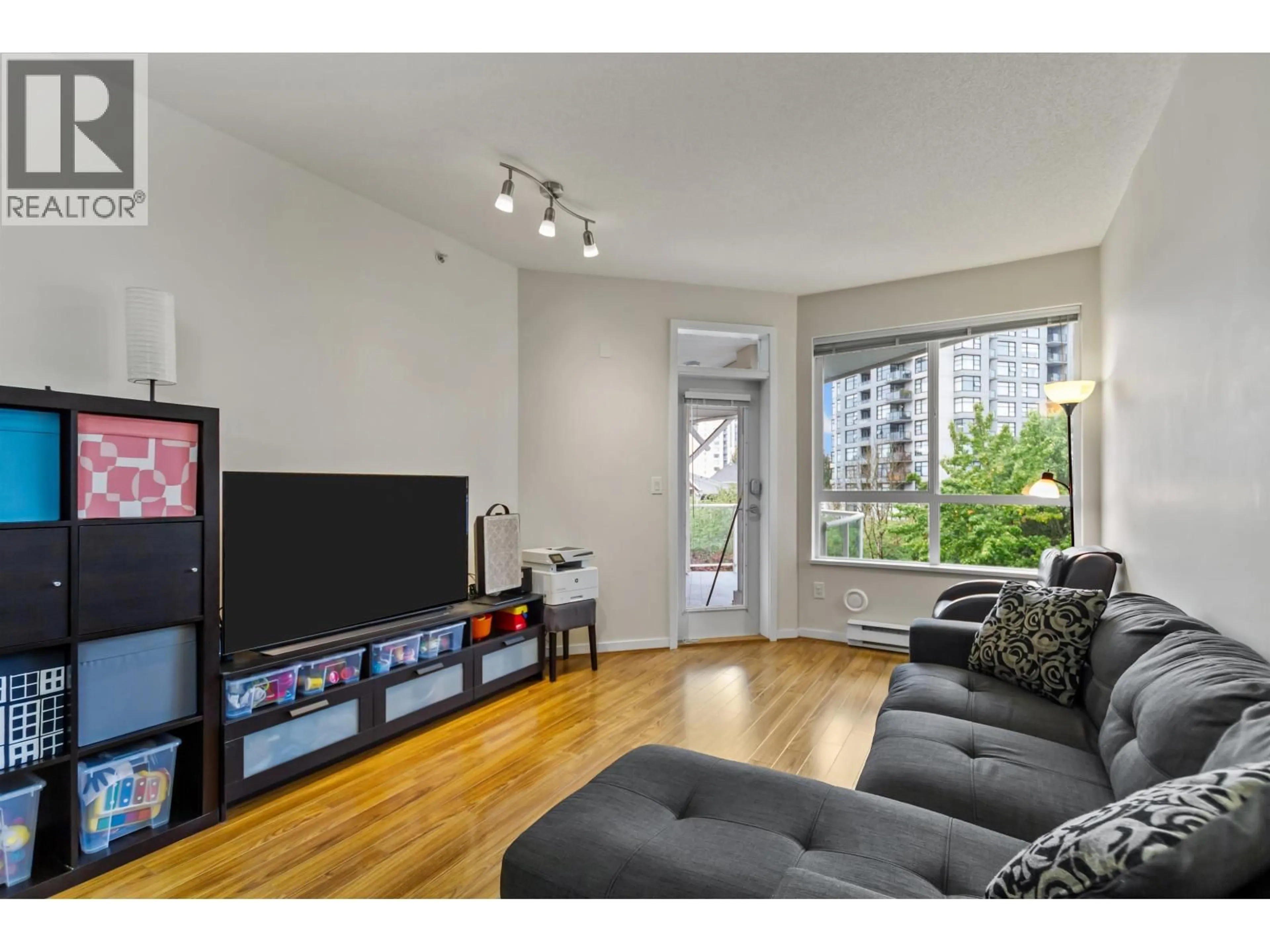 Living room with furniture, wood/laminate floor for 408 - 3651 FOSTER AVENUE, Vancouver British Columbia V5R0A2