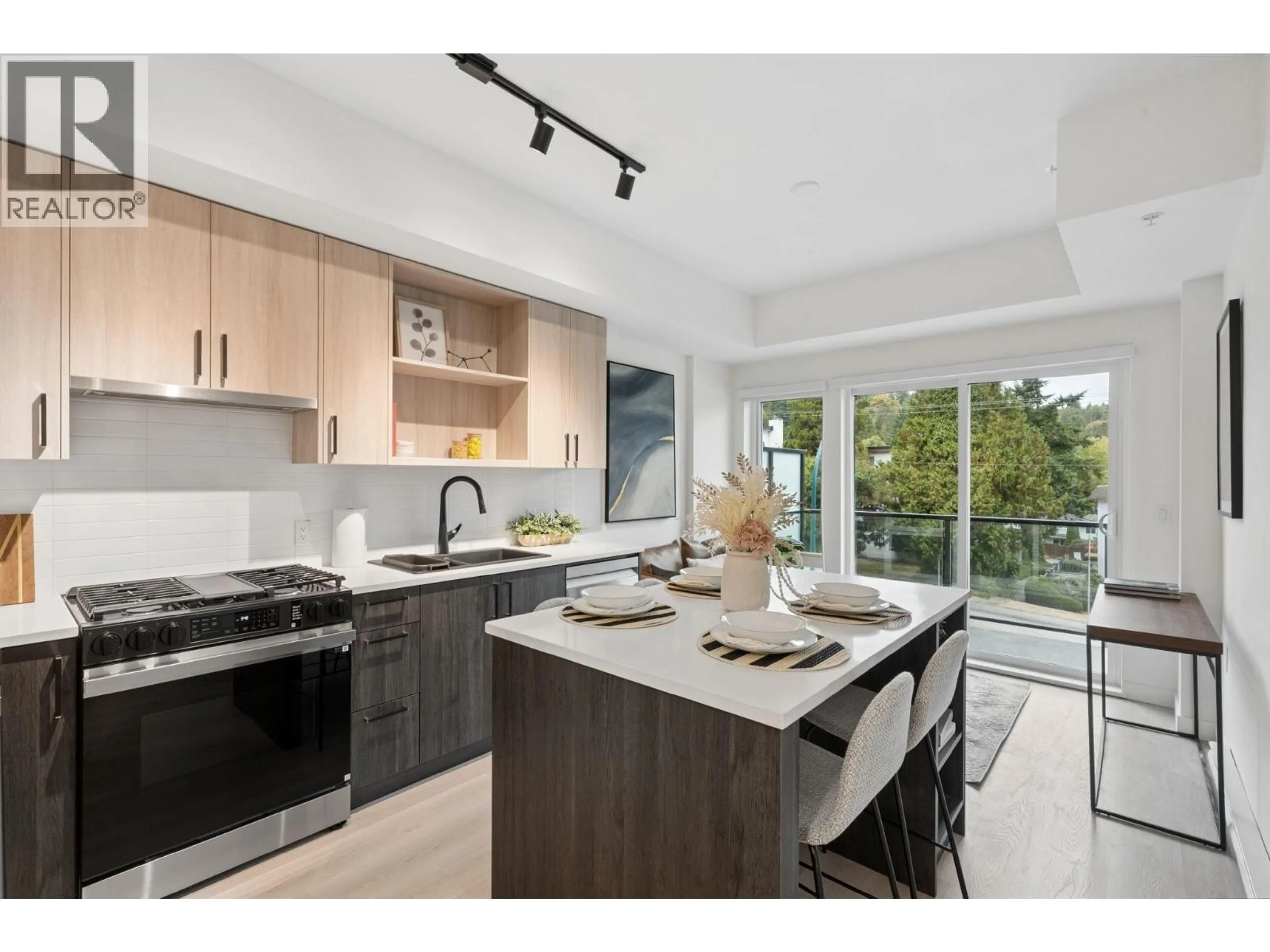 Open concept kitchen, unknown for 106 - 1100 CLARKE ROAD, Vancouver British Columbia V3H0N3