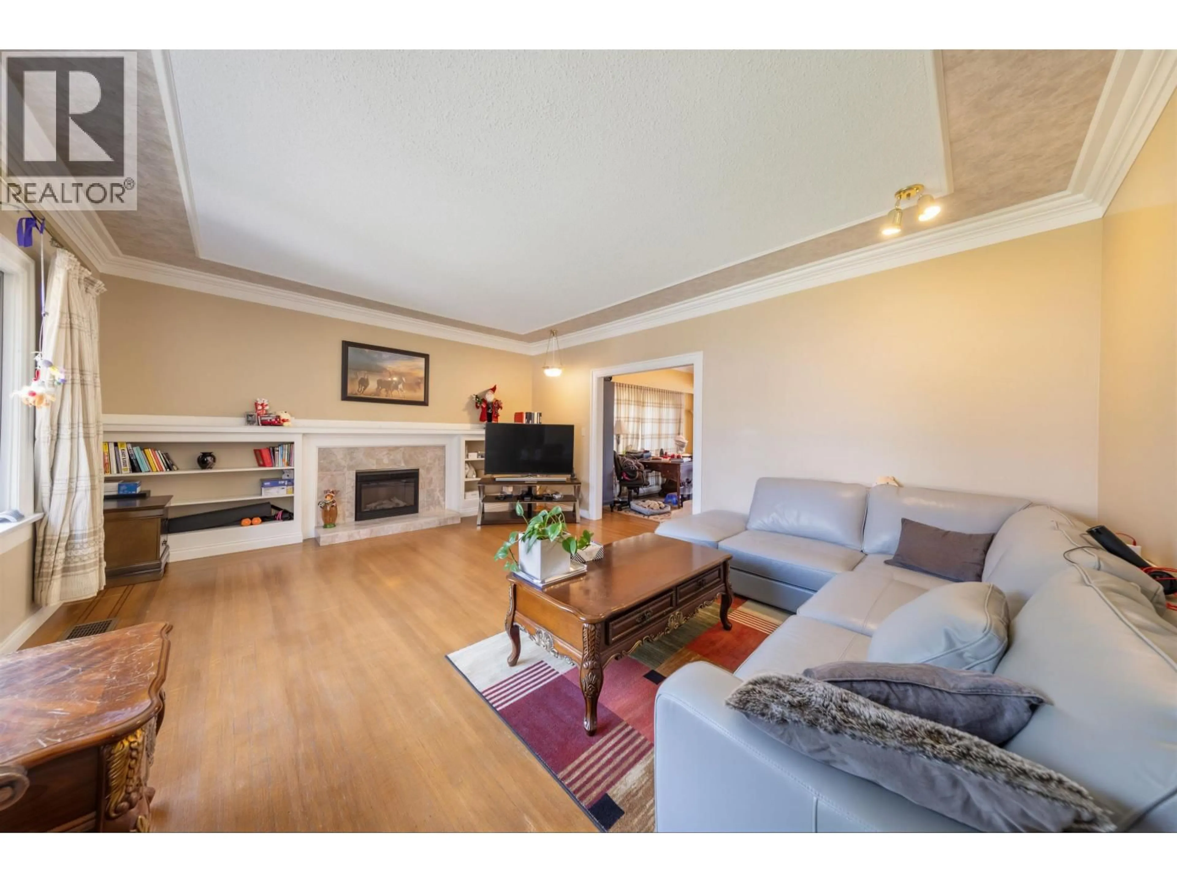 Living room with furniture, wood/laminate floor for 1986 43RD AVENUE, Vancouver British Columbia V6M2C6