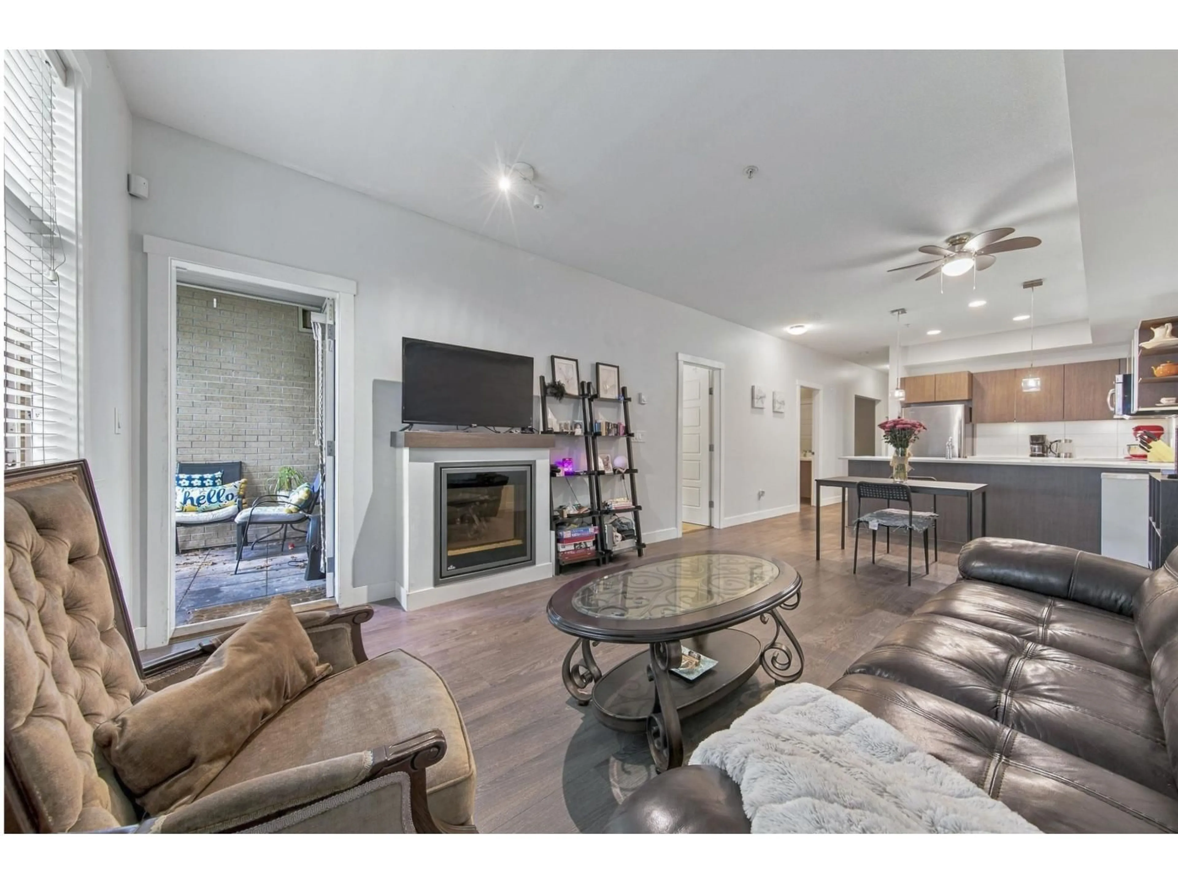 Living room with furniture, wood/laminate floor for 105 - 19936 56 AVENUE, Langley British Columbia V3A0E1