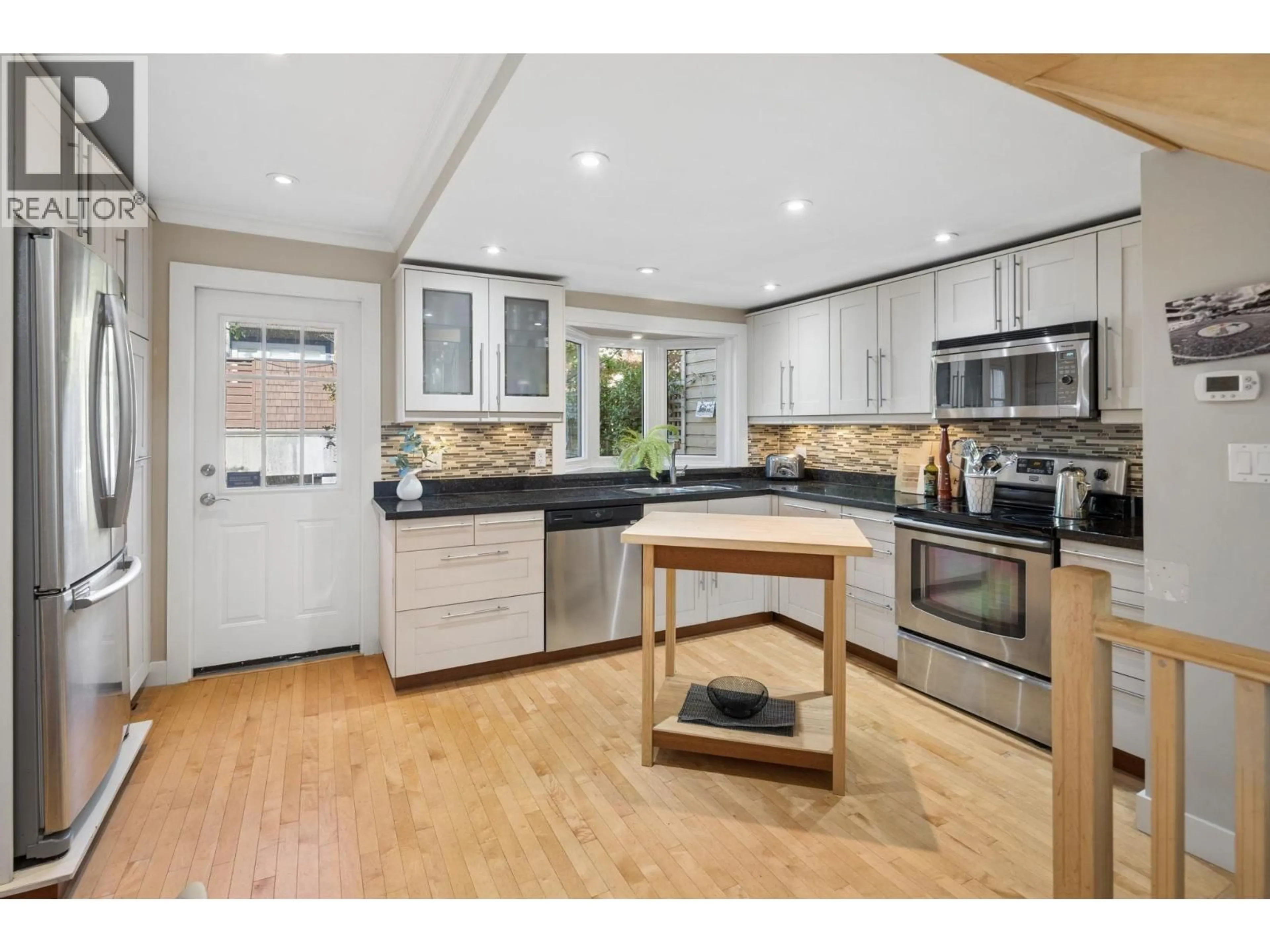 Open concept kitchen, unknown for 3 - 230 15TH STREET, North Vancouver British Columbia V7M1S2
