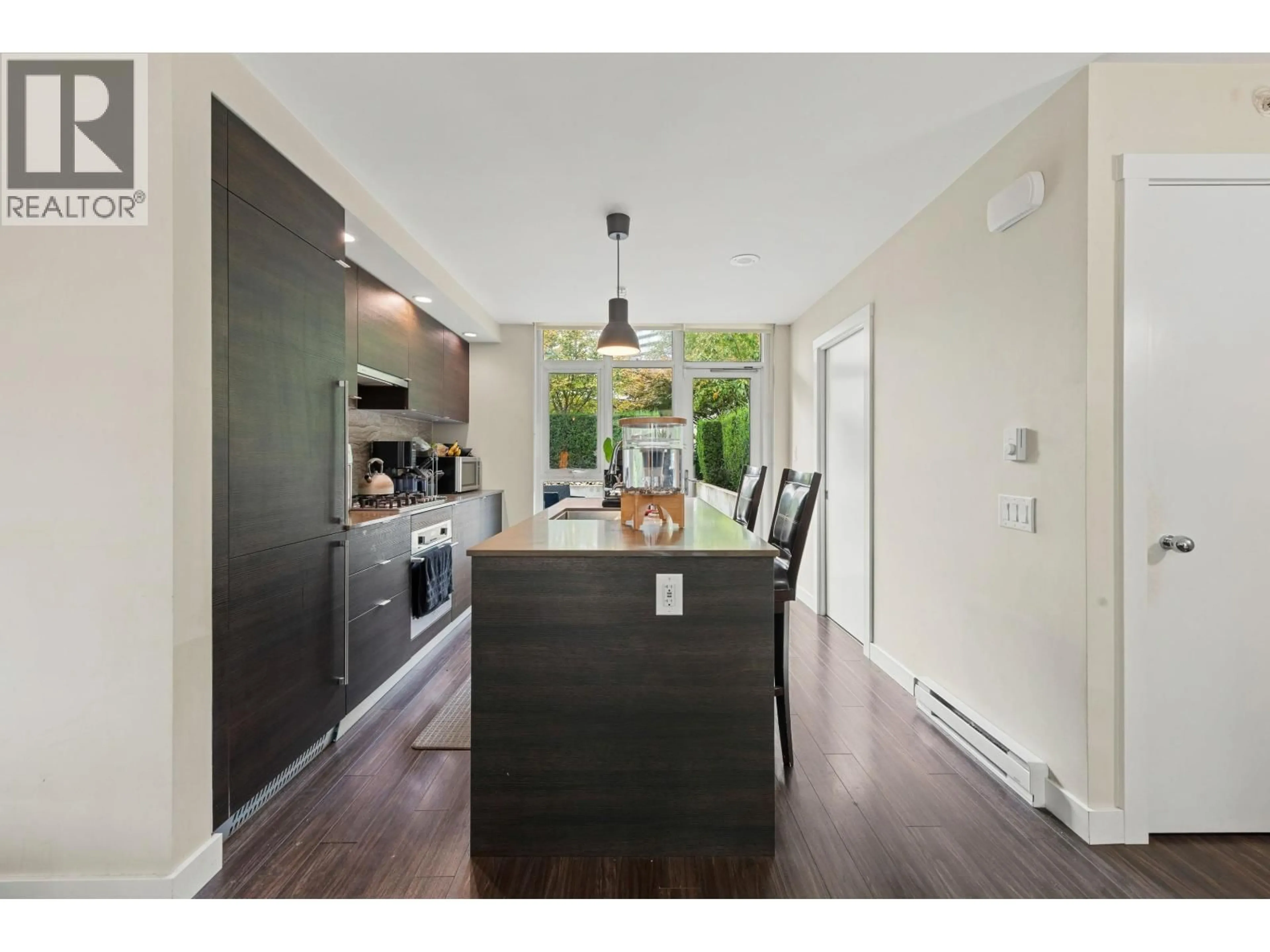 Open concept kitchen, wood/laminate floor for 104 - 578 EMERSON STREET, Coquitlam British Columbia V3J0G4