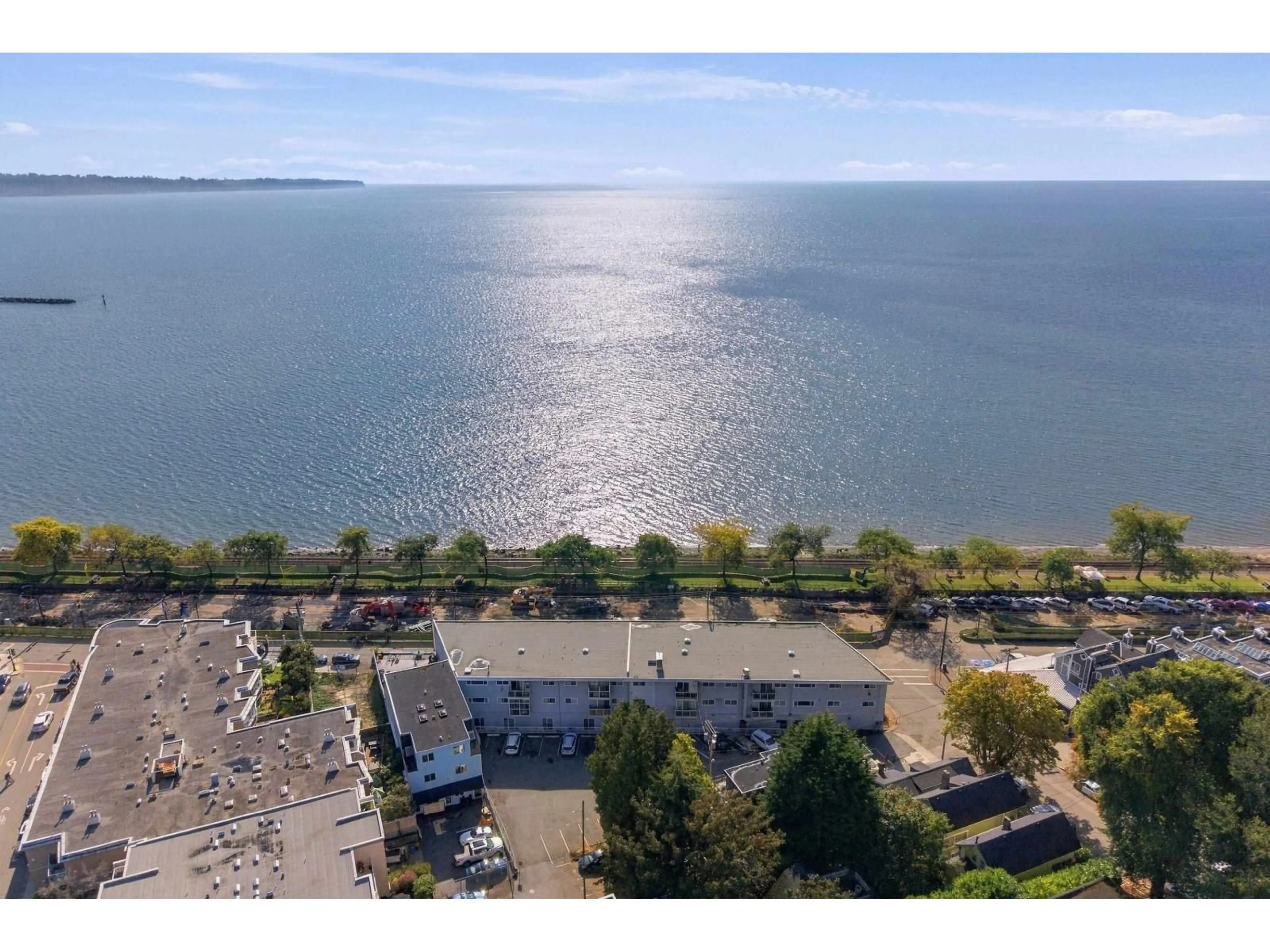 A pic from outside/outdoor area/front of a property/back of a property/a pic from drone, water/lake/river/ocean view for 106 - 14881 MARINE DRIVE, White Rock British Columbia V4B1C2