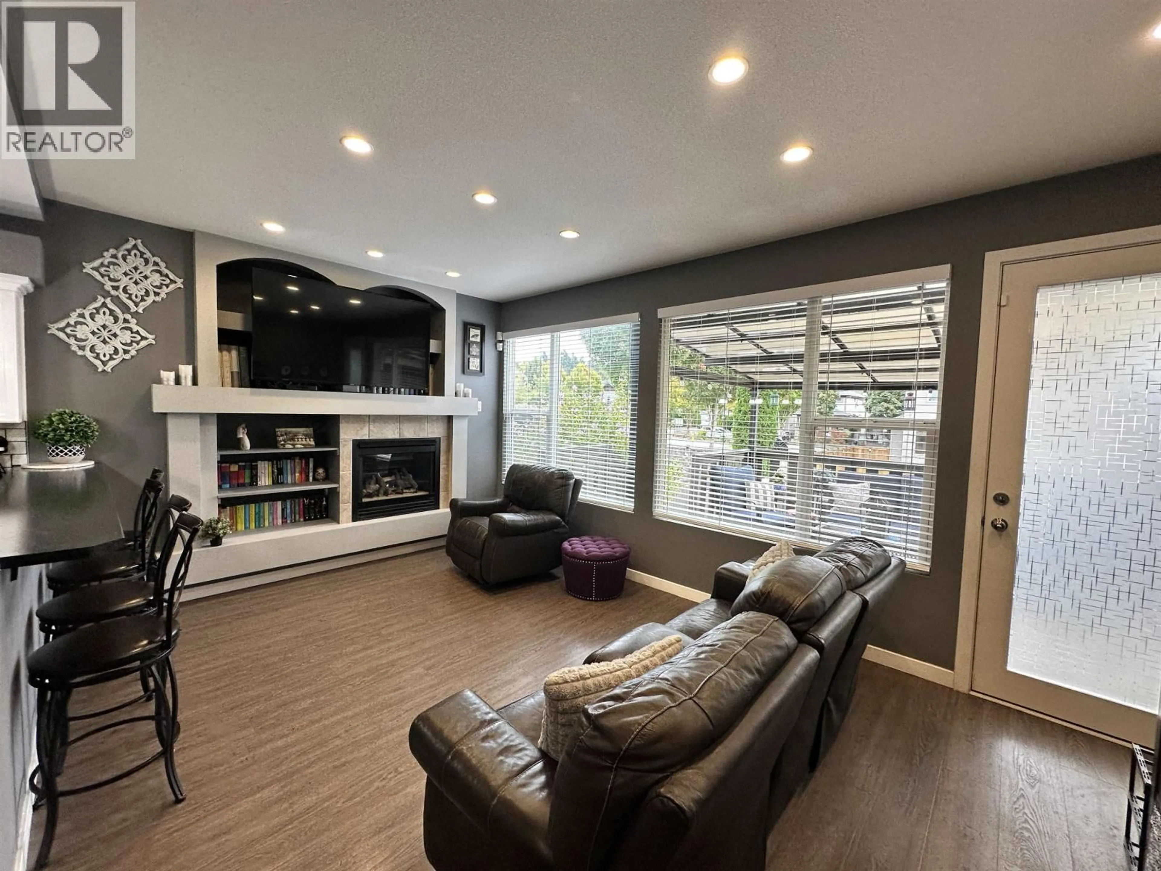 Living room with furniture, wood/laminate floor for 24292 102B AVENUE, Maple Ridge British Columbia V2W1Y1