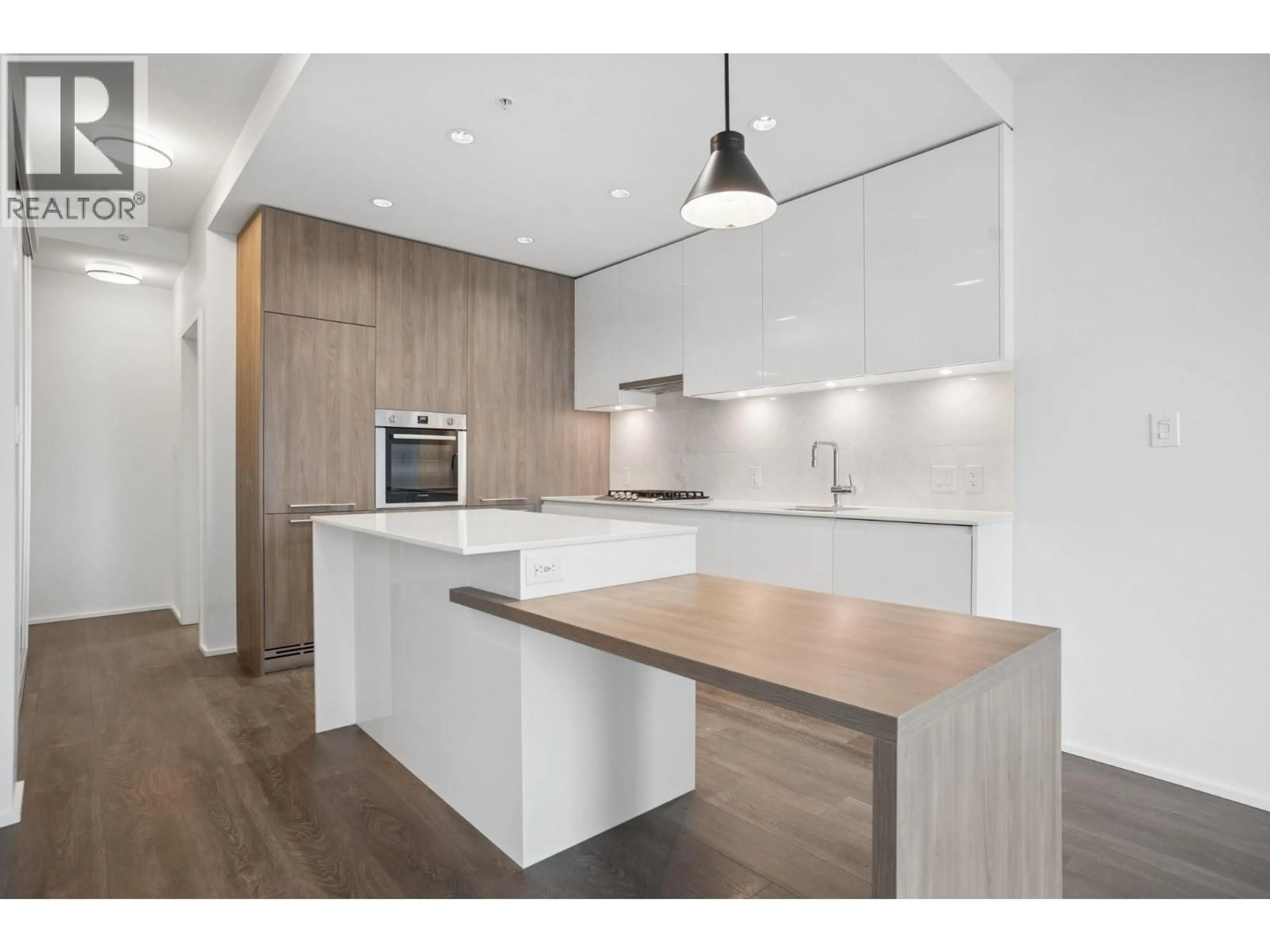 Open concept kitchen, wood/laminate floor for 2301 - 1955 ALPHA WAY, Burnaby British Columbia V5C0K6