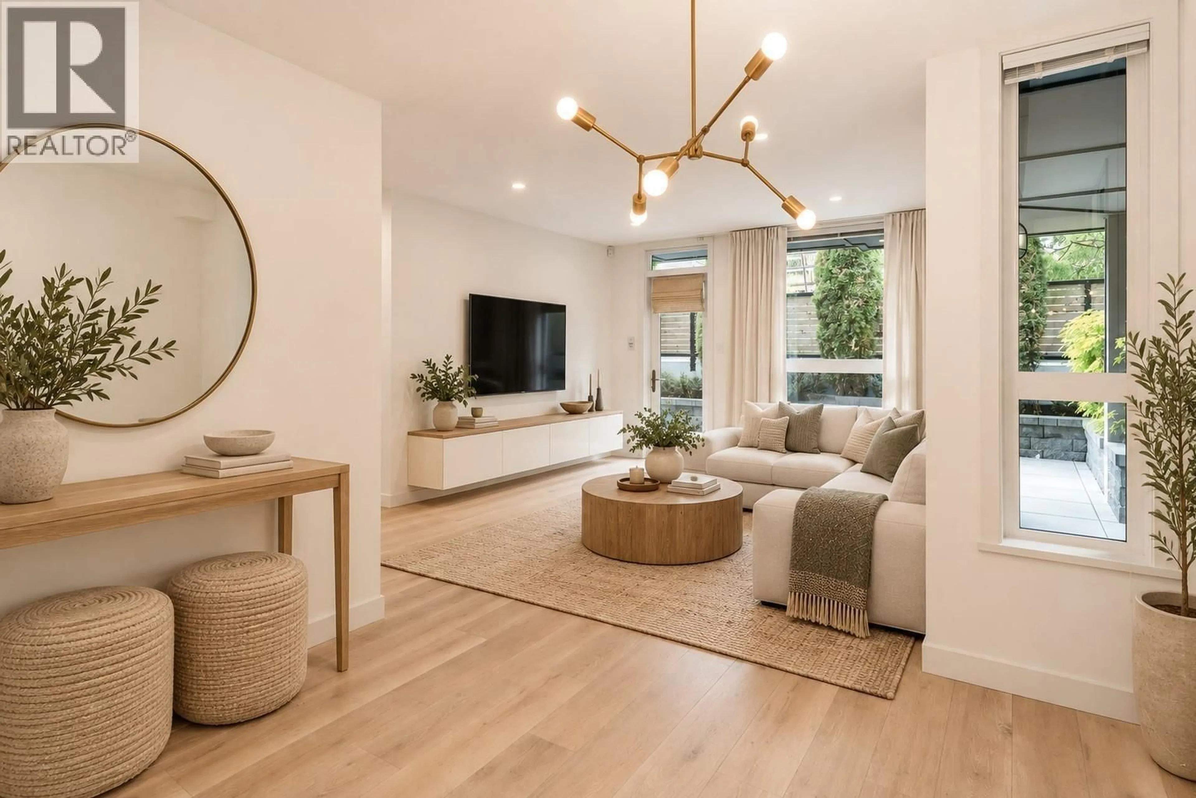 Living room with furniture, wood/laminate floor for 101 - 562 7TH AVENUE, Vancouver British Columbia V5T1N7