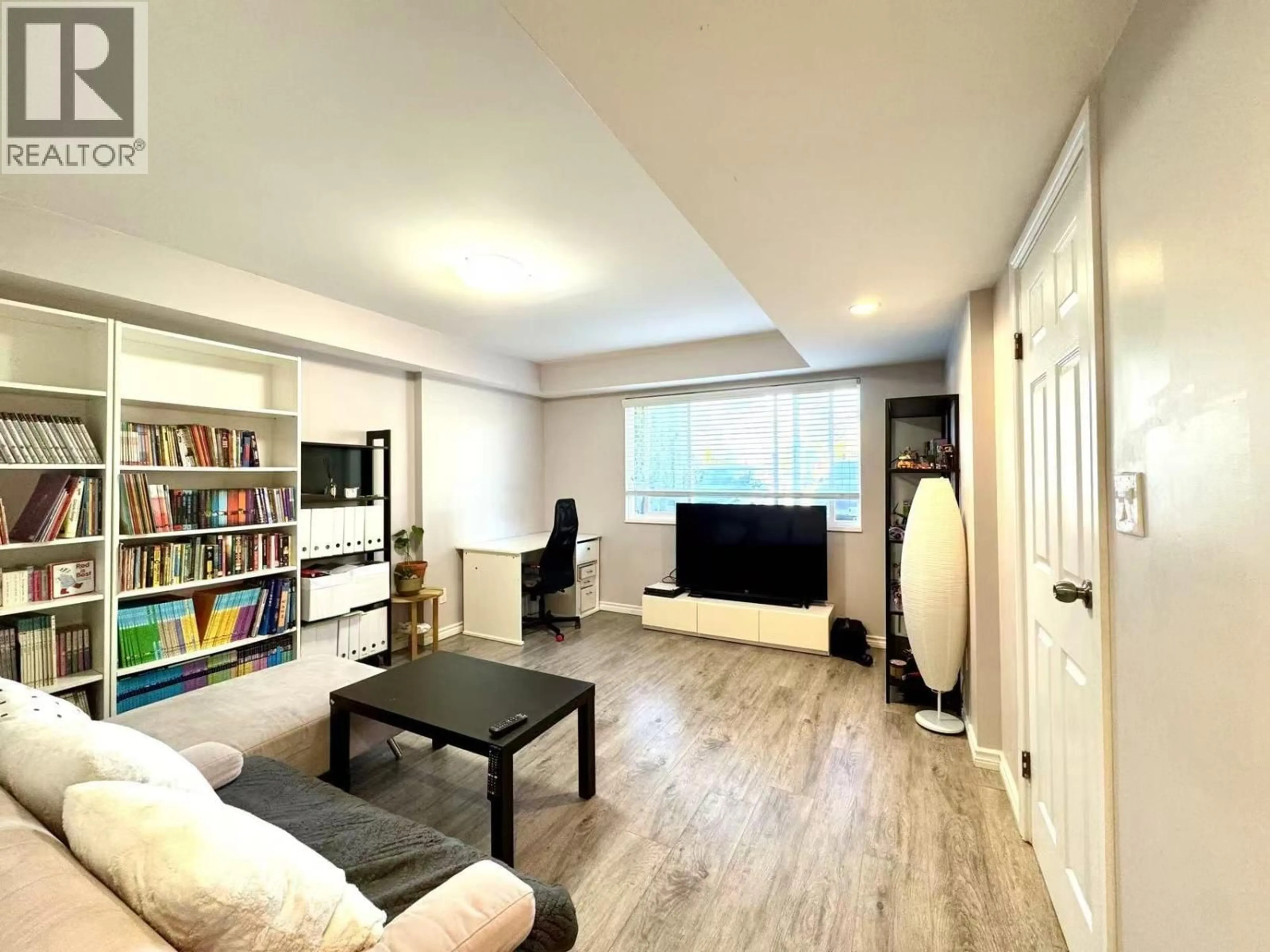Living room with furniture, wood/laminate floor for 1818 FRASER AVENUE, Port Coquitlam British Columbia V3B1N1