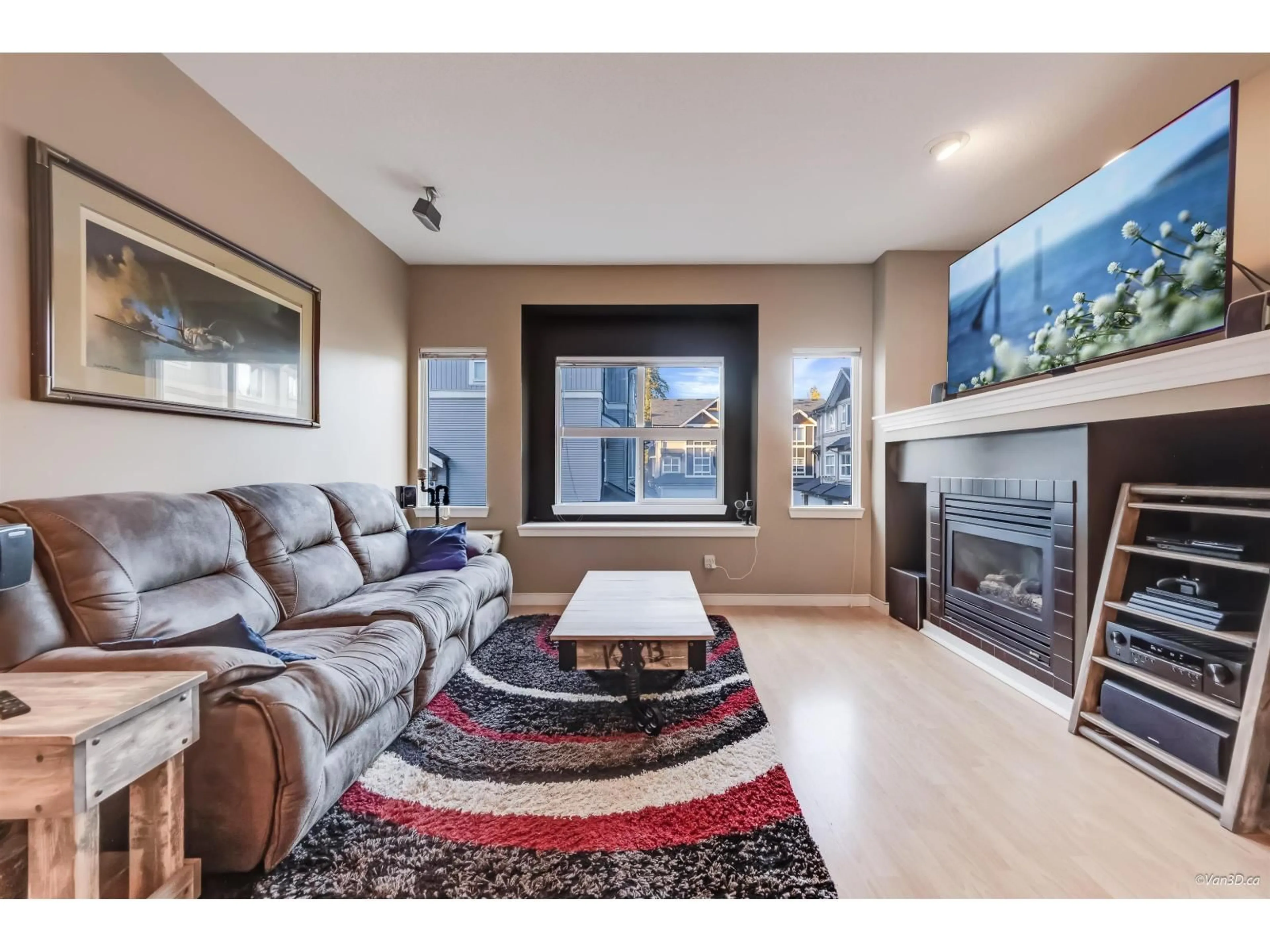 Living room with furniture, wood/laminate floor for 48 - 12677 63 AVENUE, Surrey British Columbia V3X3T3