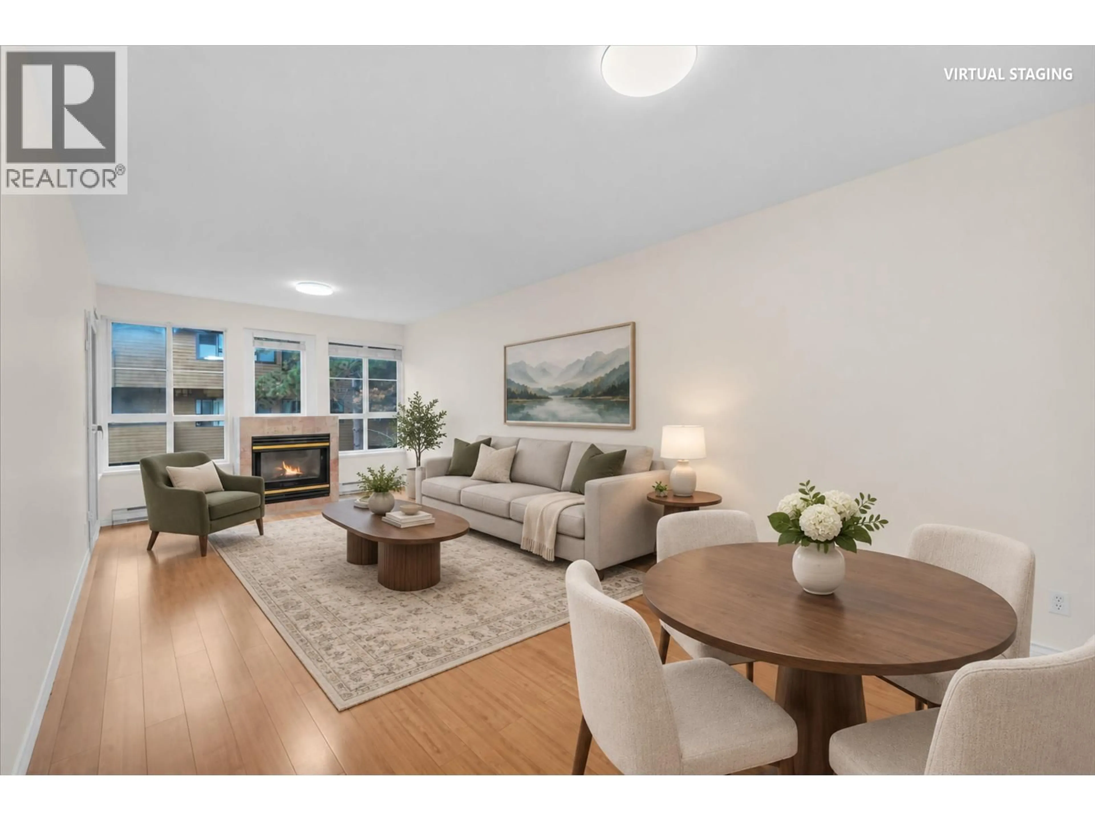 Living room with furniture, wood/laminate floor for 205 - 7300 GILBERT ROAD, Richmond British Columbia V7C3W2