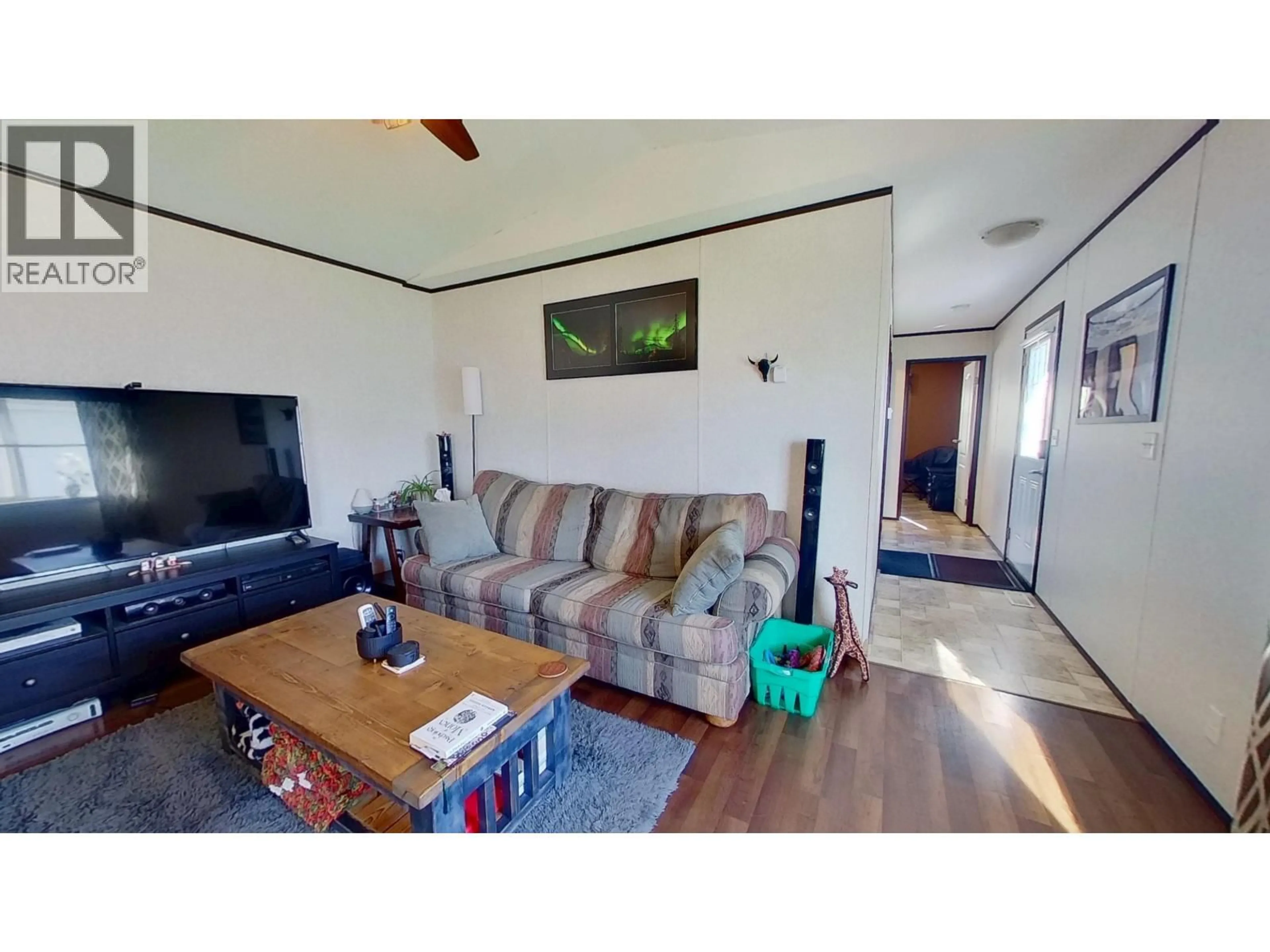 Living room with furniture, wood/laminate floor for 26A - 6828 ALCAN FRONTAGE ROAD, Fort St. John British Columbia V0C1C3